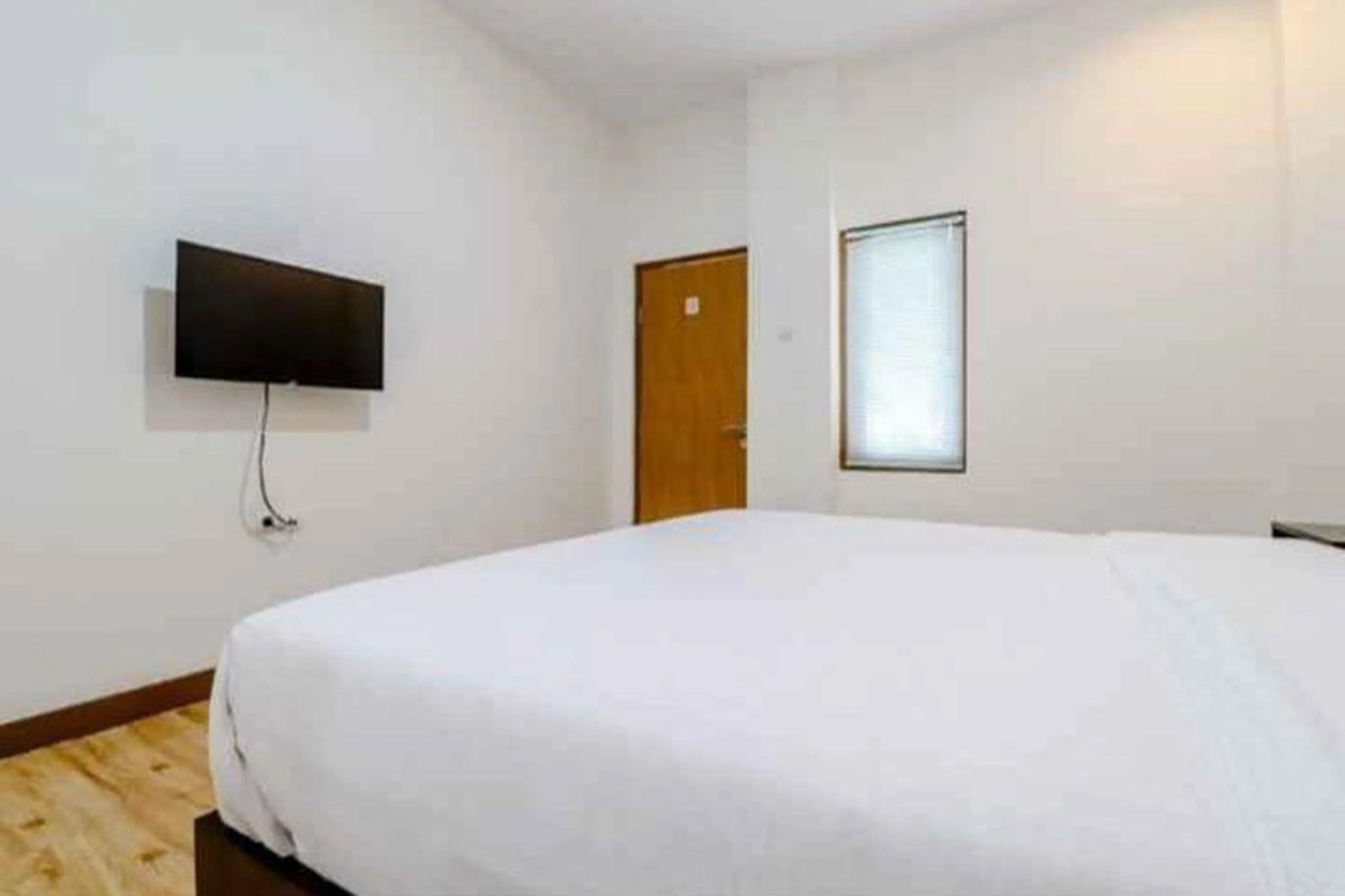 Bed in Hotel Sumaryo