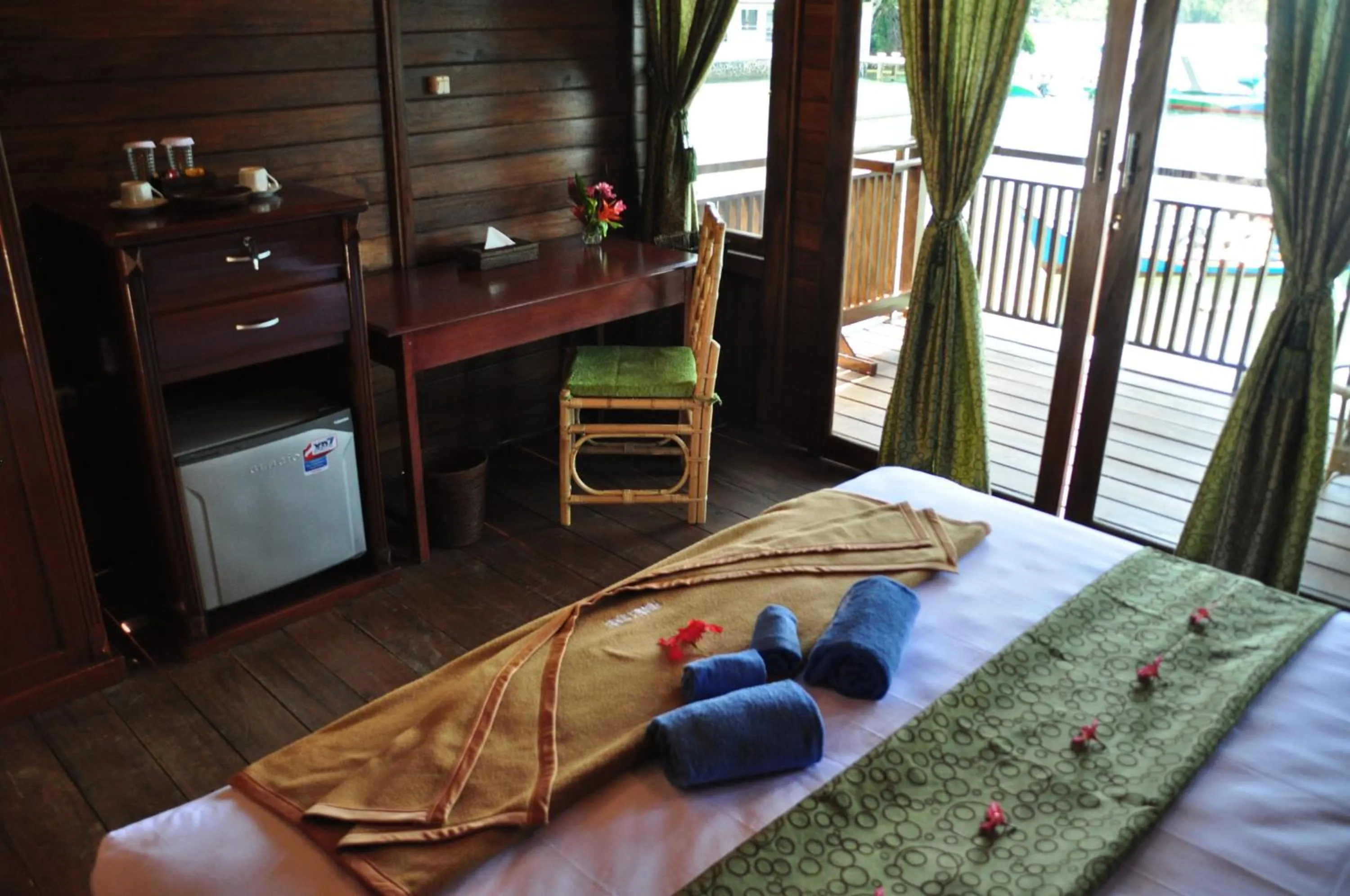 Bed in Bastianos Lembeh Dive Resort