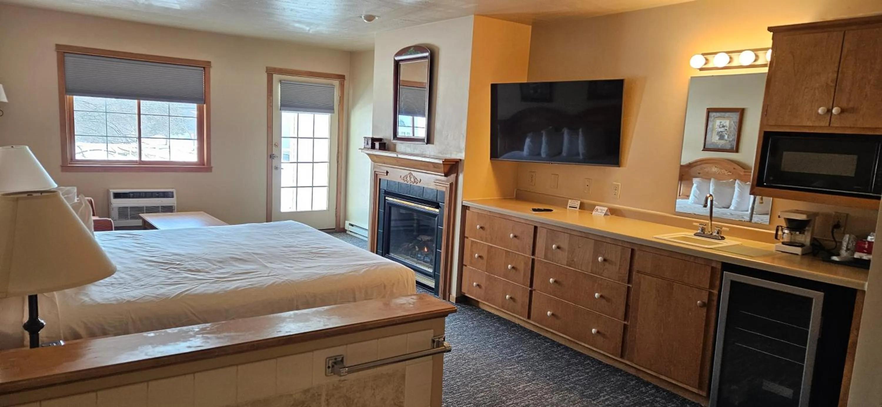 fireplace, Bed in Homestead Suites - Fish Creek