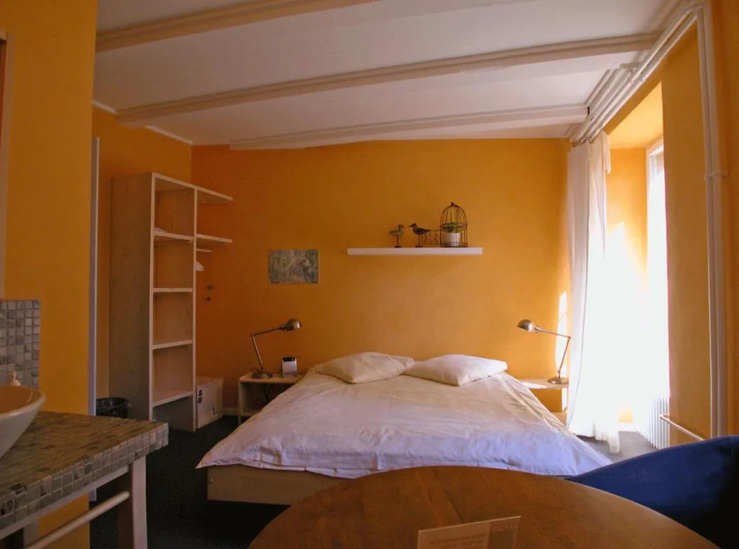 Bed in Le Café-Hôtel de L'Aubier