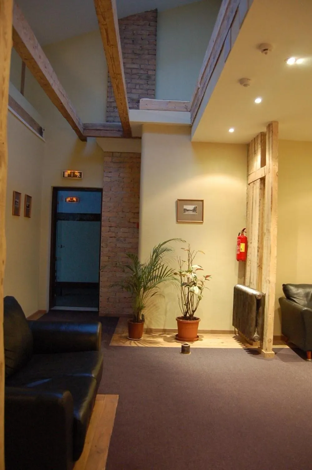 Seating area, Bed in Cafe Hotel Rudzons