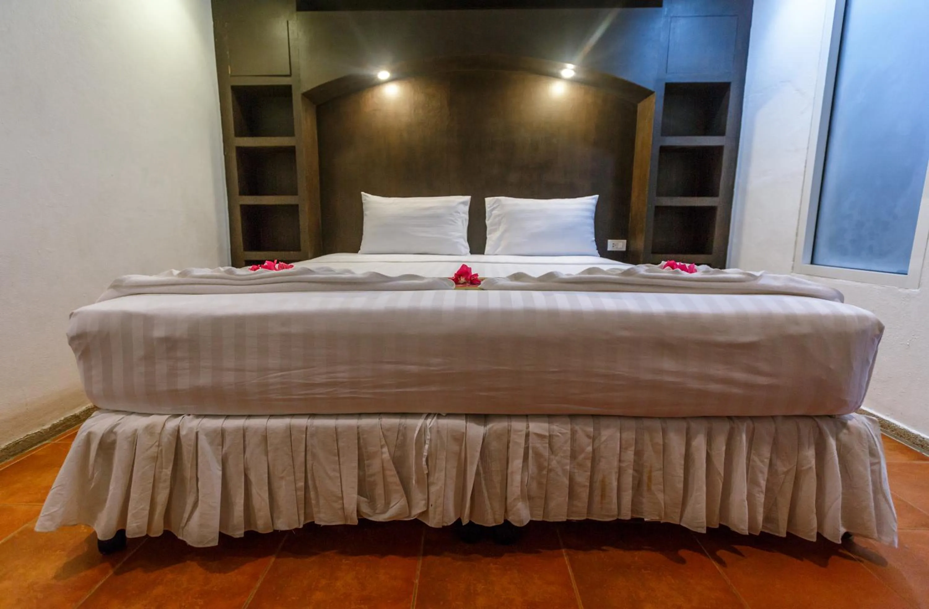 Bed in PorterHouse Beach Hotel