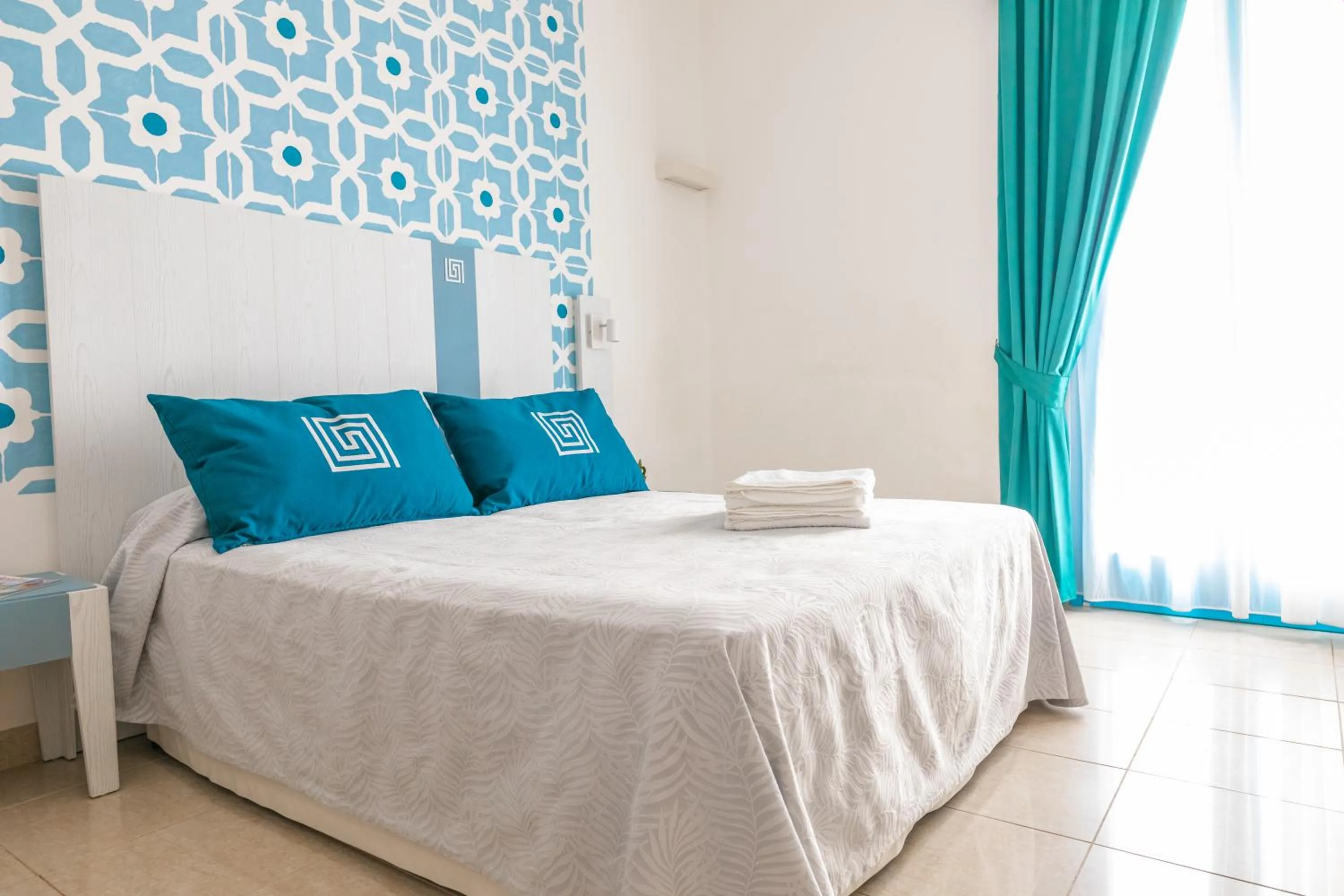 Bed in Hotel Magna Grecia