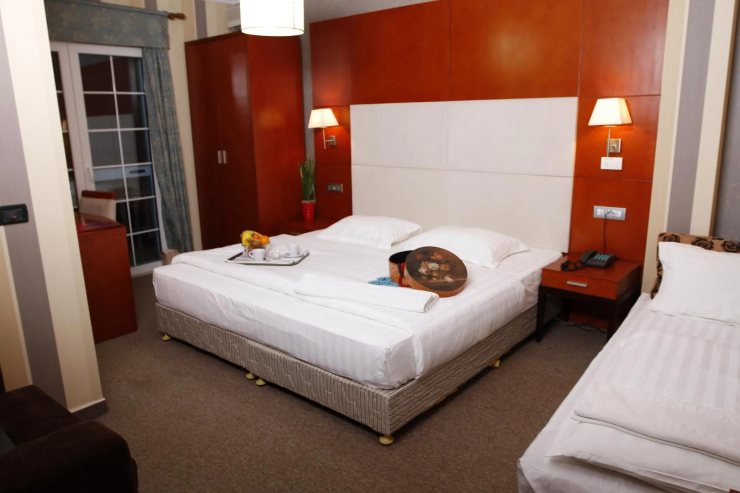 Bed in Bel Conti Hotel