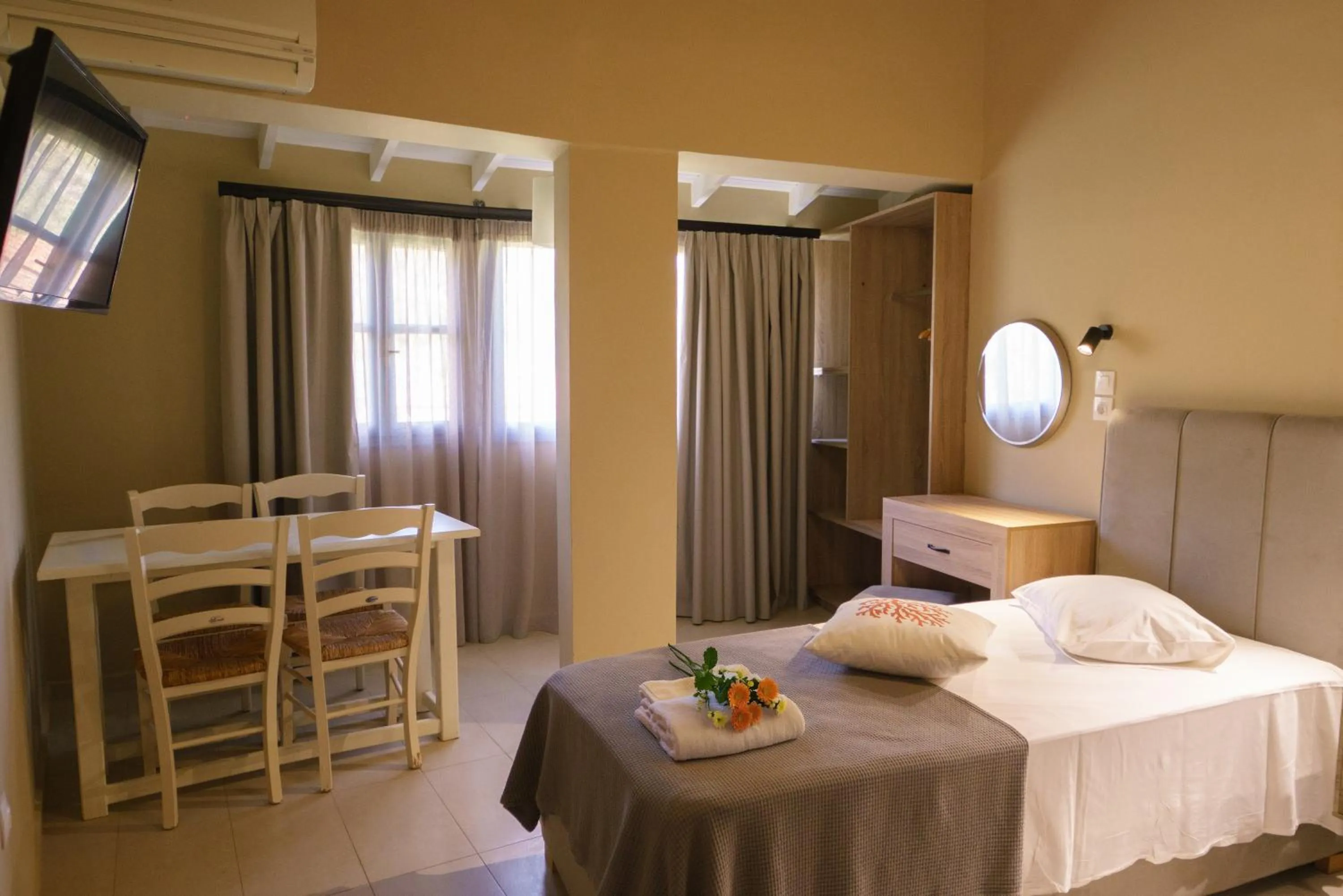 Bed in Rouda Bay Beach Hotel