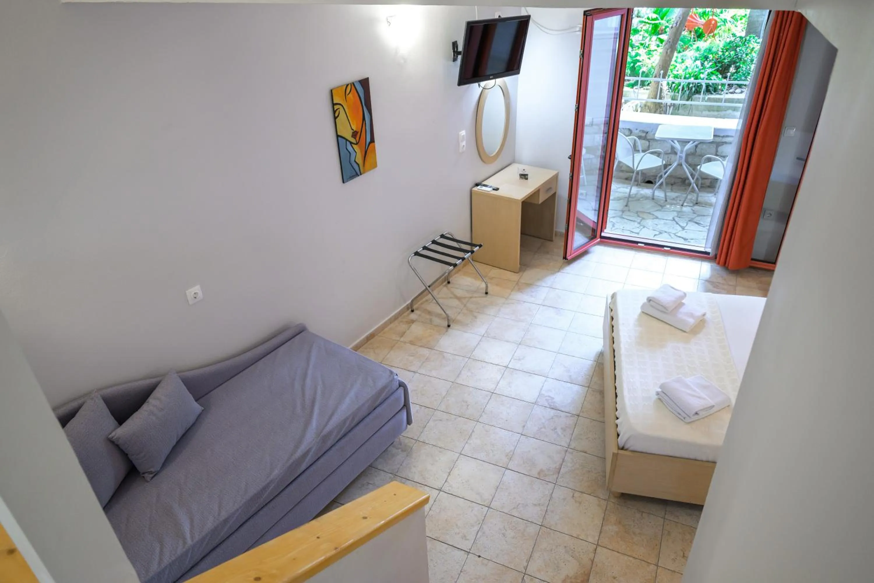 Bed in Rouda Bay Beach Hotel