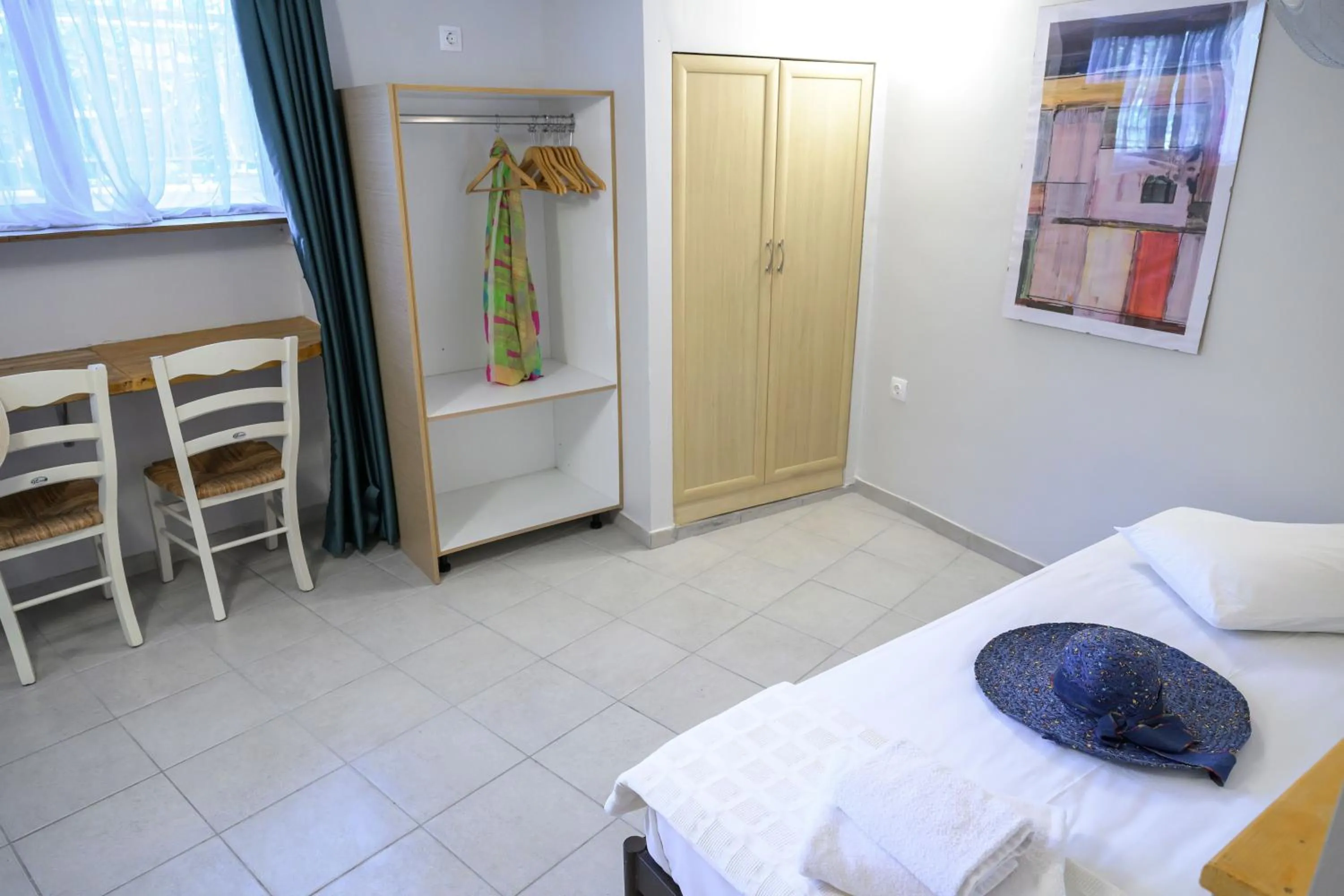 Bed in Rouda Bay Beach Hotel