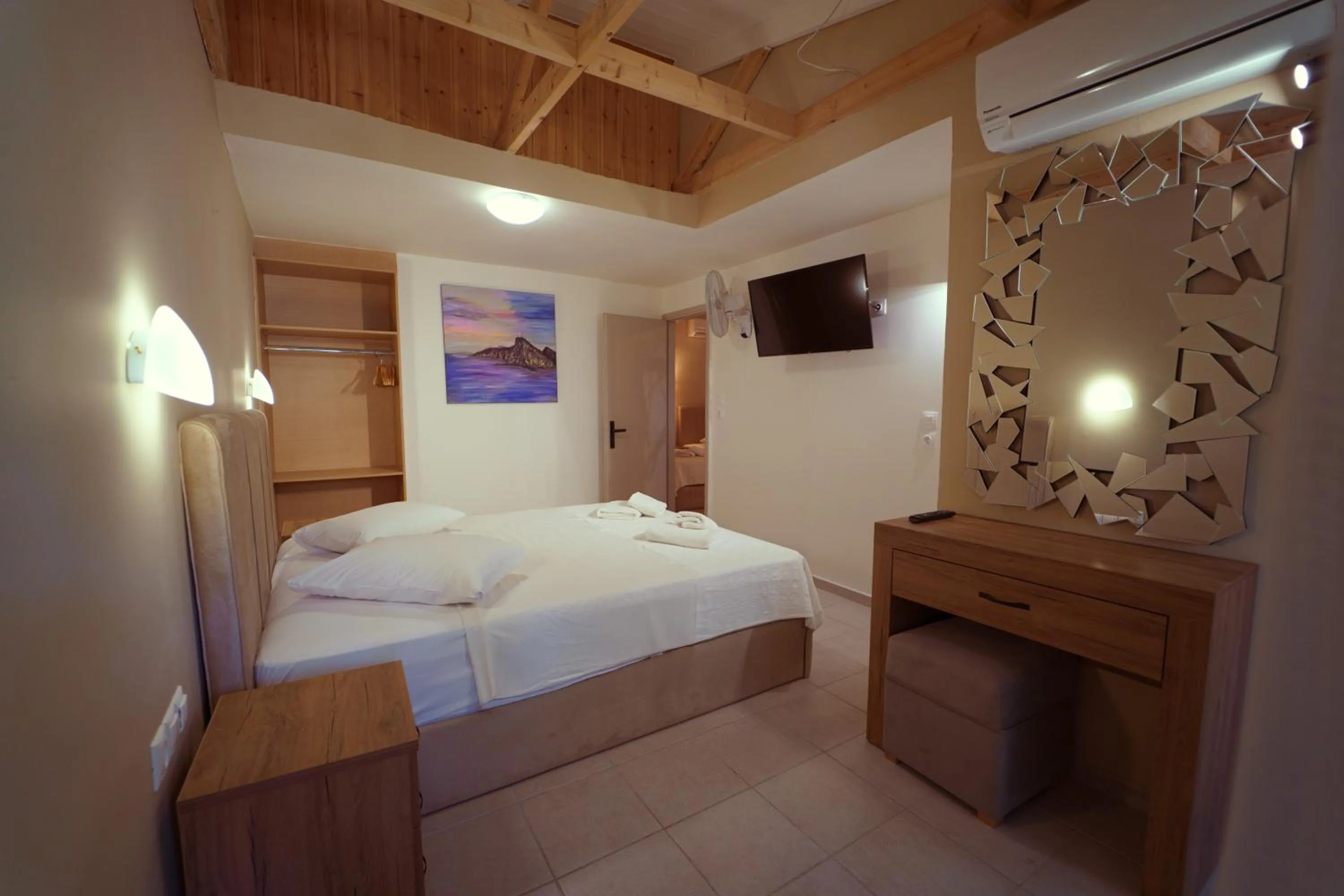 Bed in Rouda Bay Beach Hotel