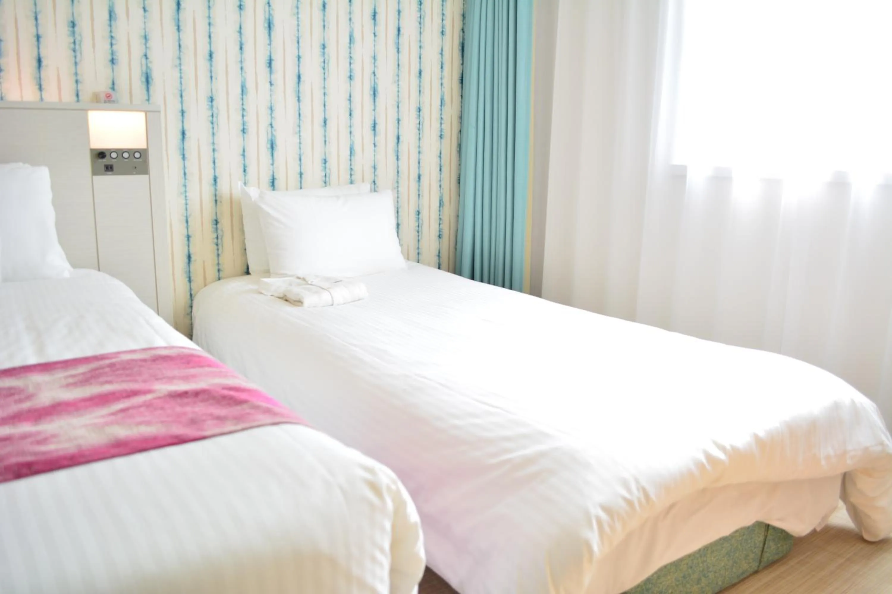 Bed in Hotel JAL City Naha