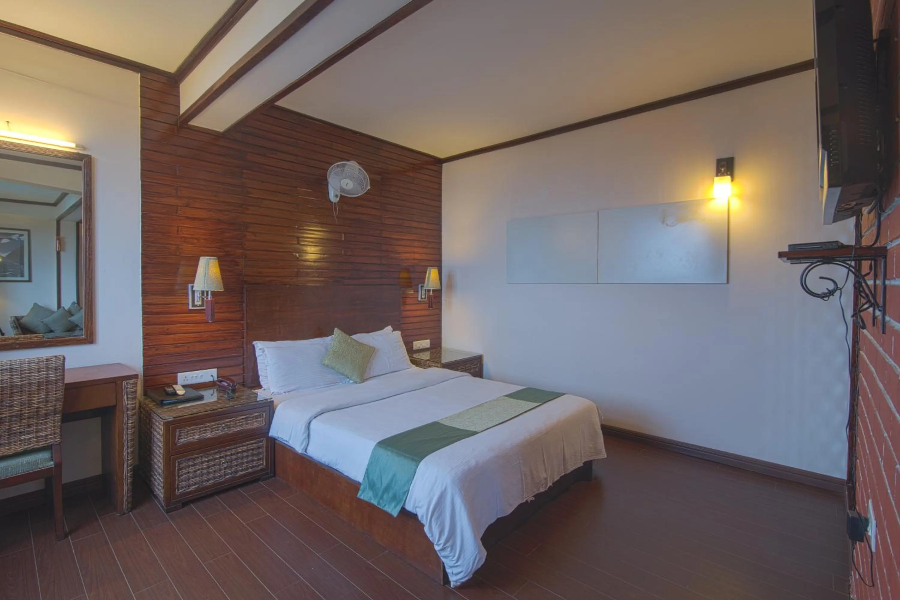 Communal lounge/ TV room, Bed in The Nettle and Fern Hotel Gangtok