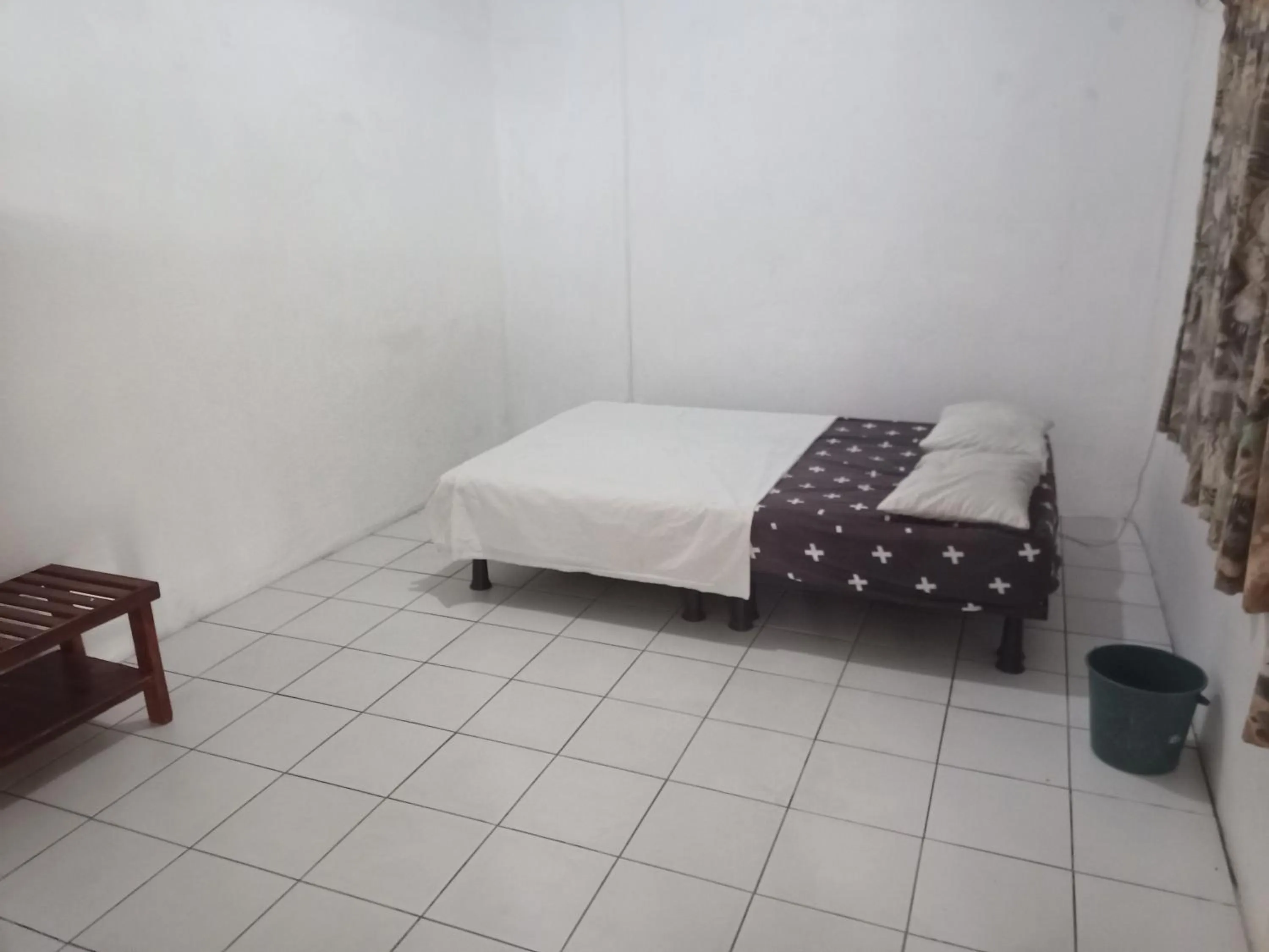 Bed in Bluepango Guest House