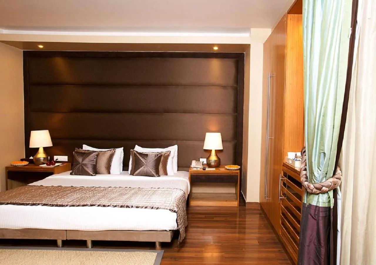Bed in Udman Hotel Panchshila Park