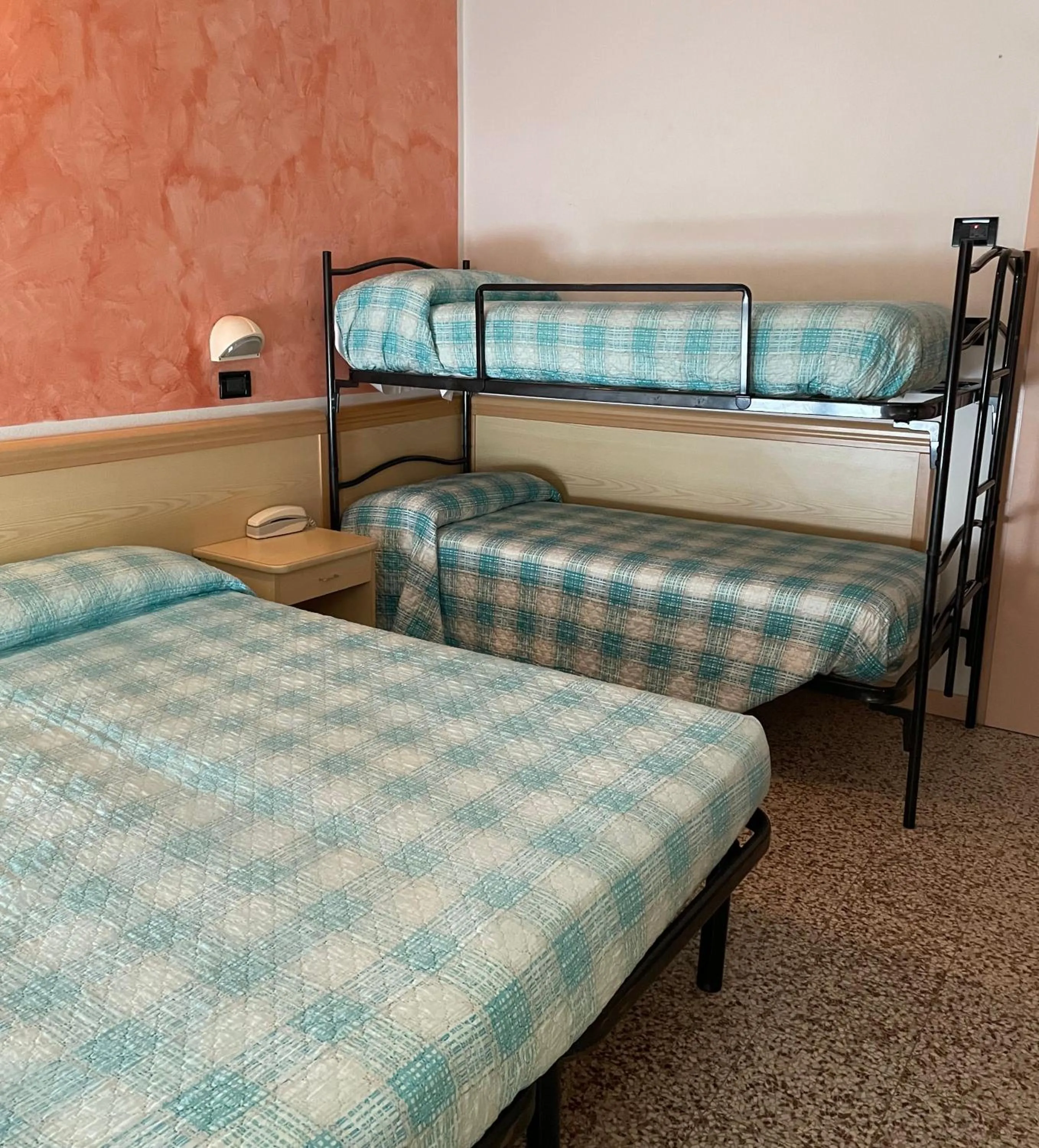 Bed in Piccolo Hotel