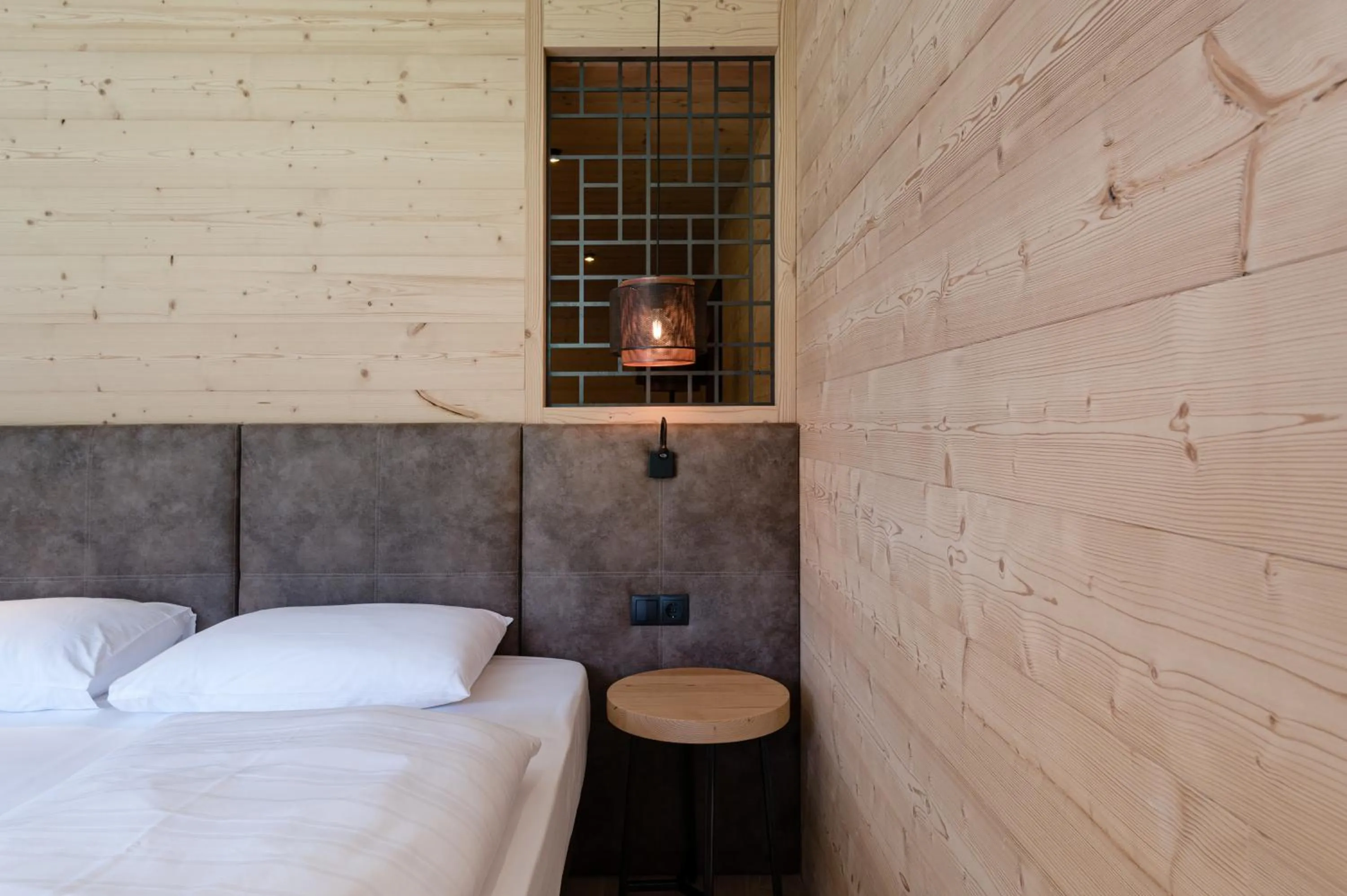 Bed in Alpine Nature Hotel Stoll