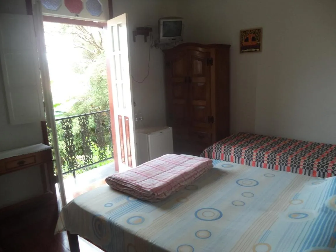 Photo of the whole room, Bed in Pousada Dona Denis