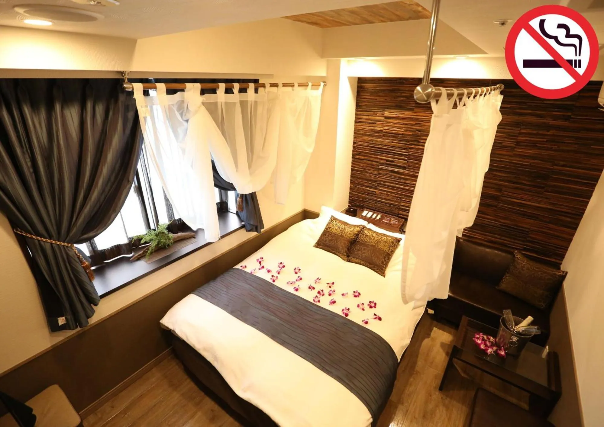 Bed in HOTEL PetitBali Higashi-Shinjuku