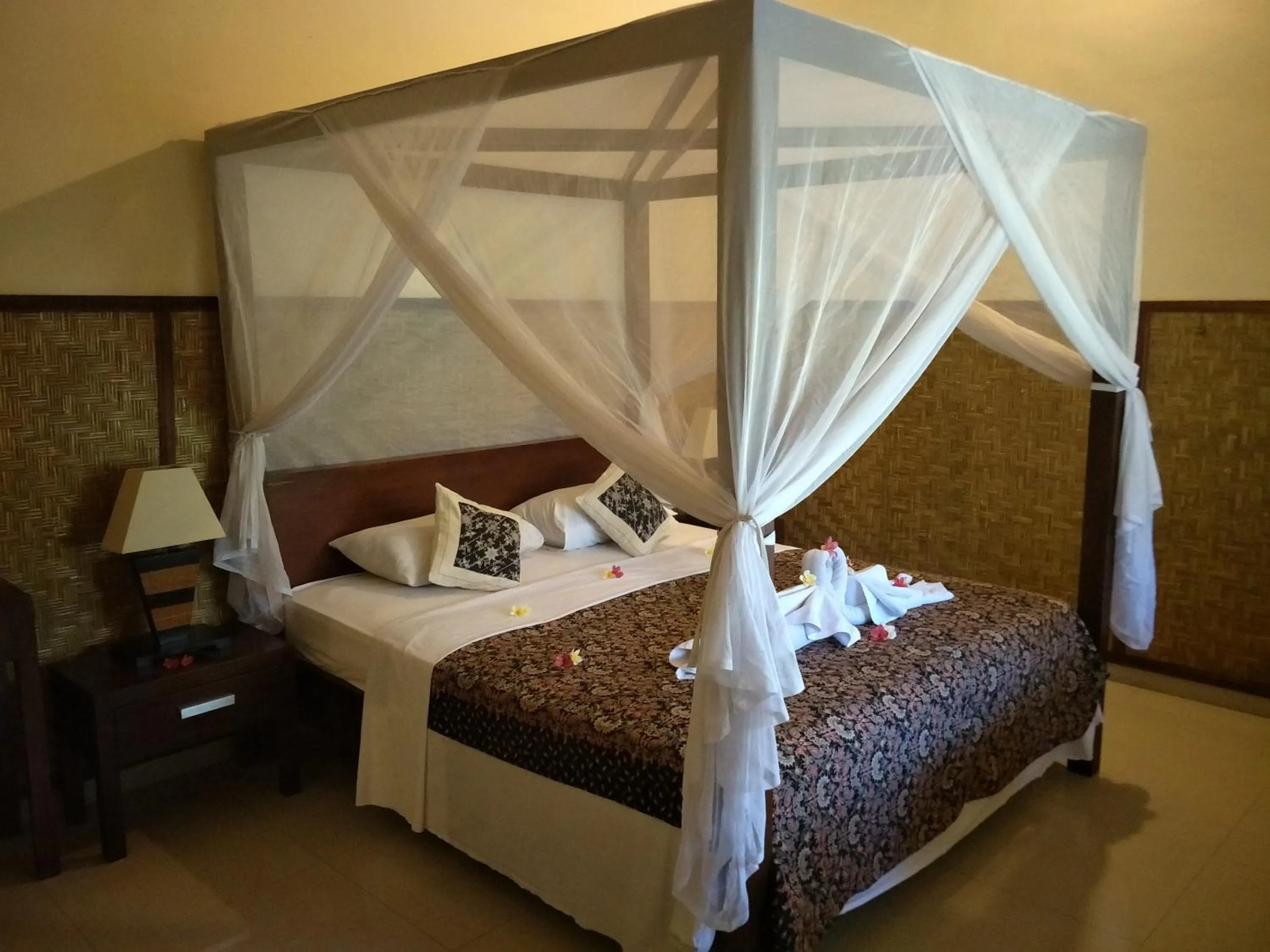 Bed in Frangipani Beach Hotel