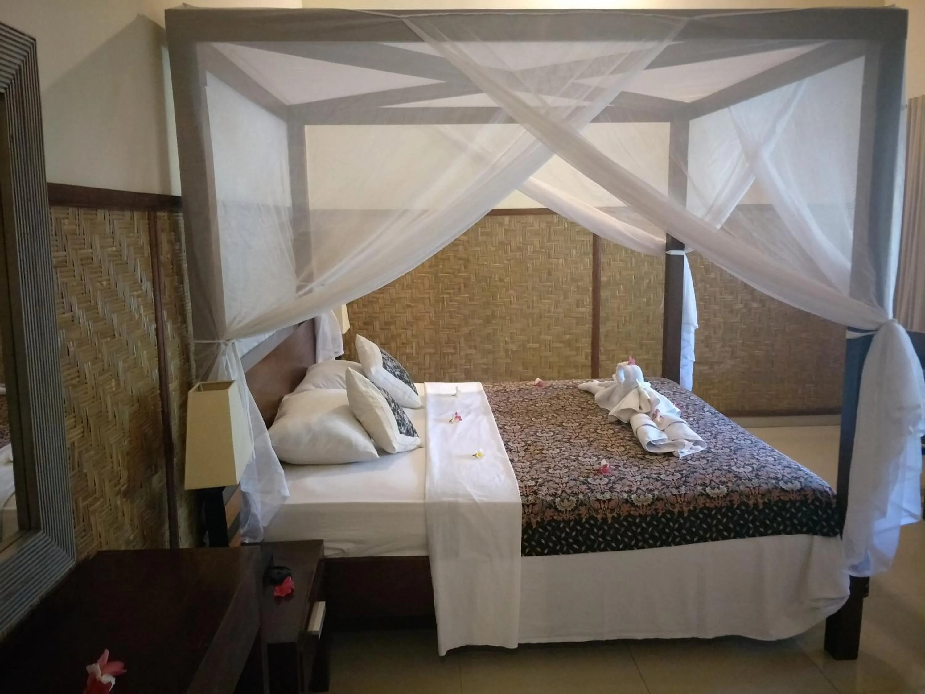 Bed in Frangipani Beach Hotel