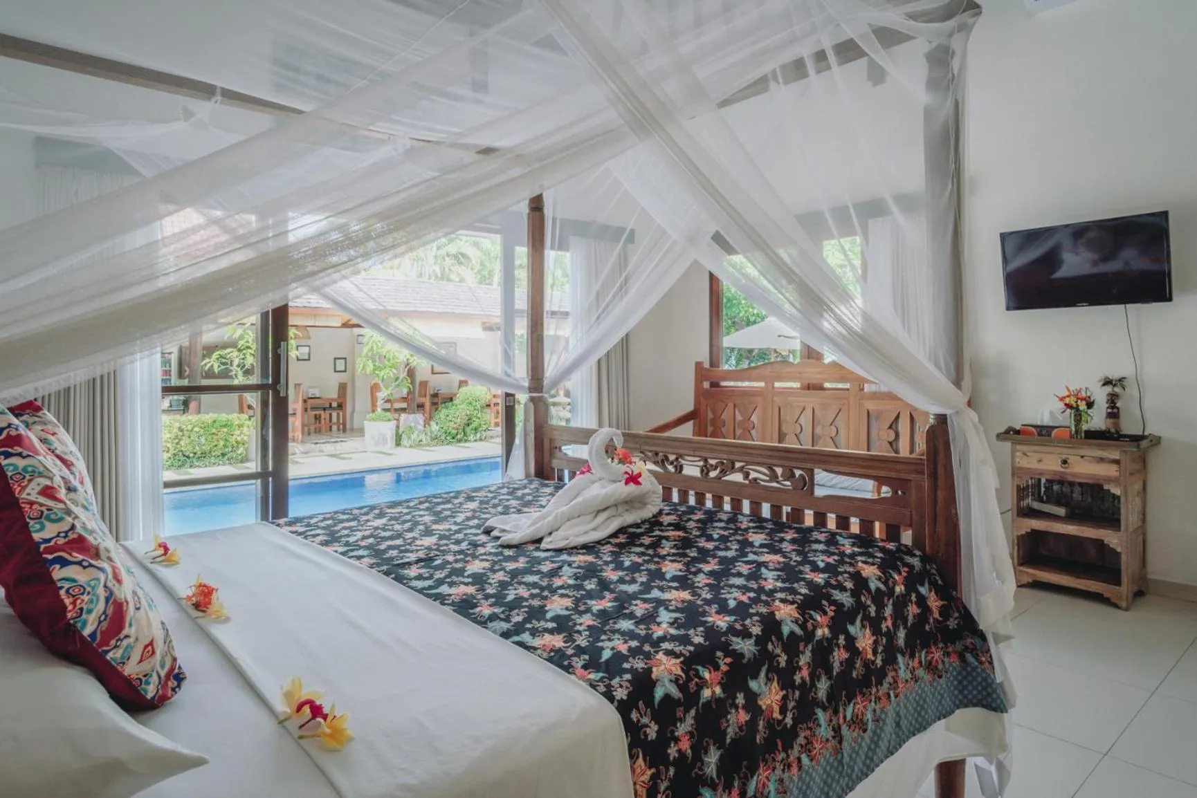 Bed in Frangipani Beach Hotel