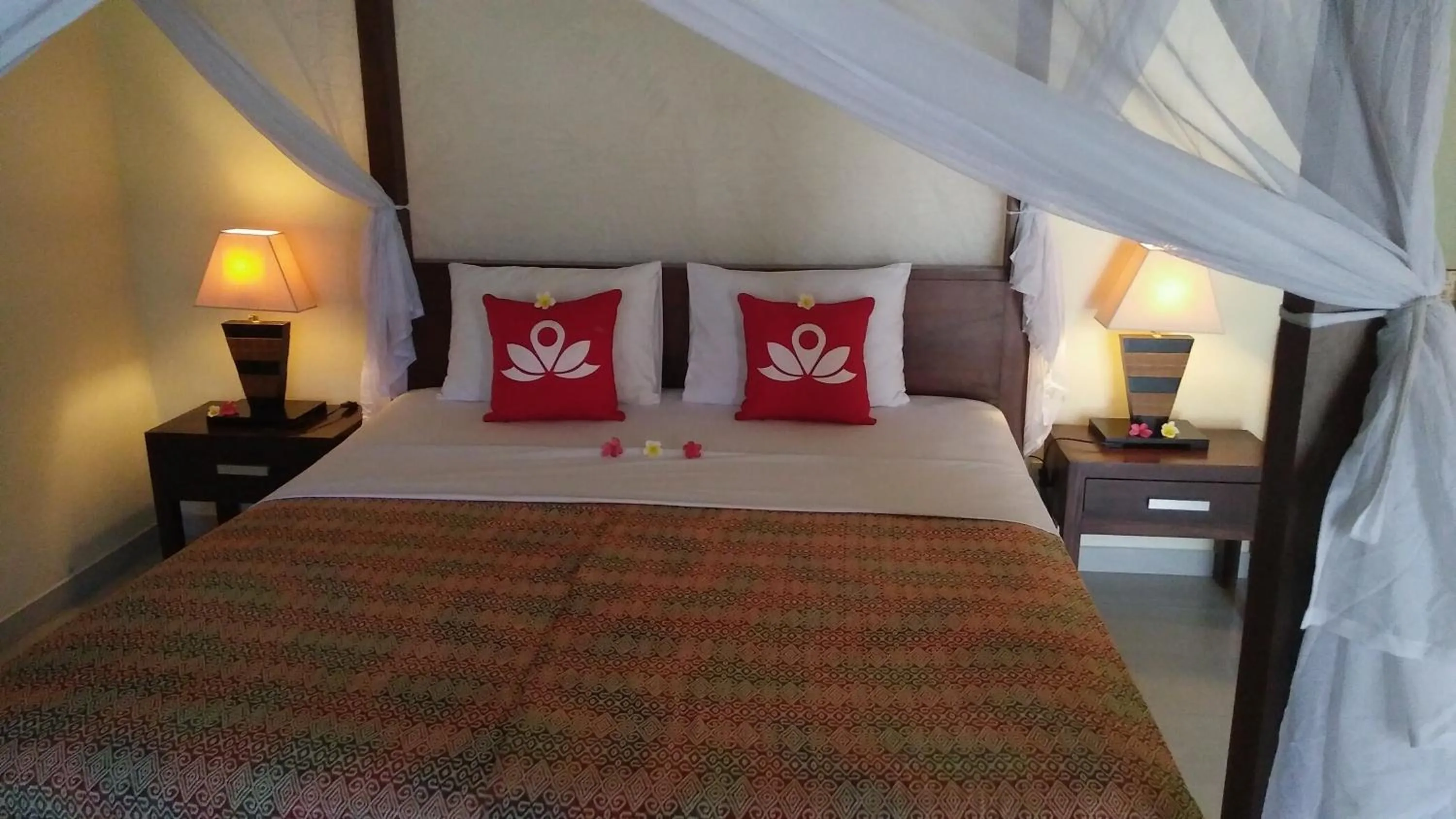 Bed in Frangipani Beach Hotel