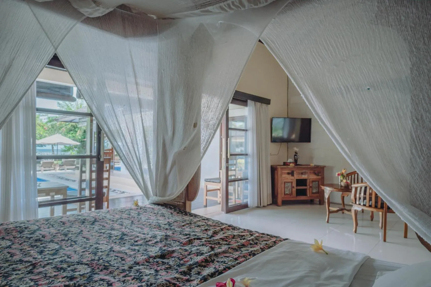 Bed in Frangipani Beach Hotel