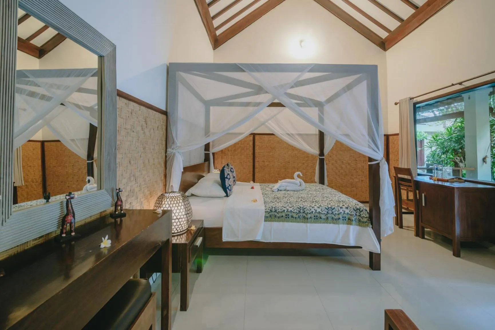 Bed in Frangipani Beach Hotel