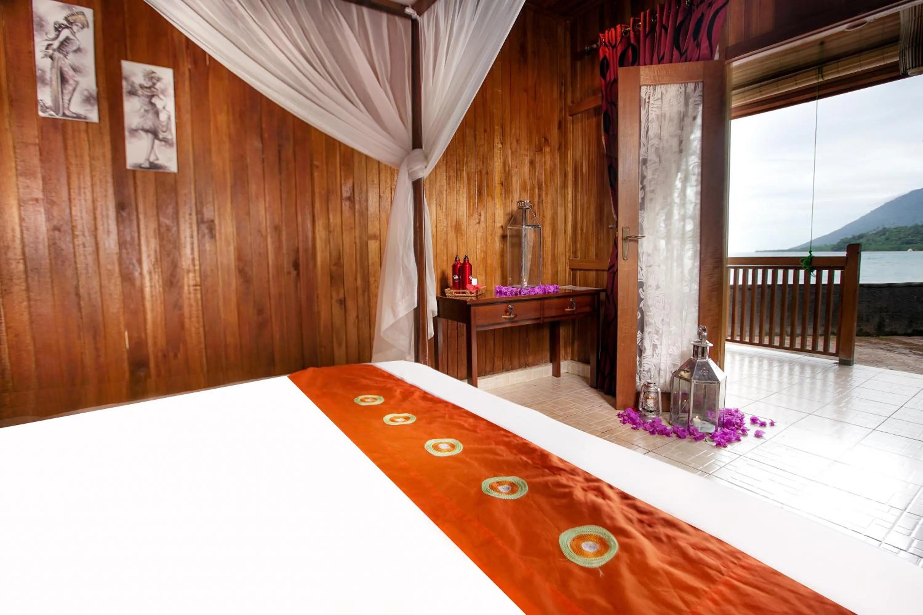 Bed in Bastianos Bunaken Dive Resort