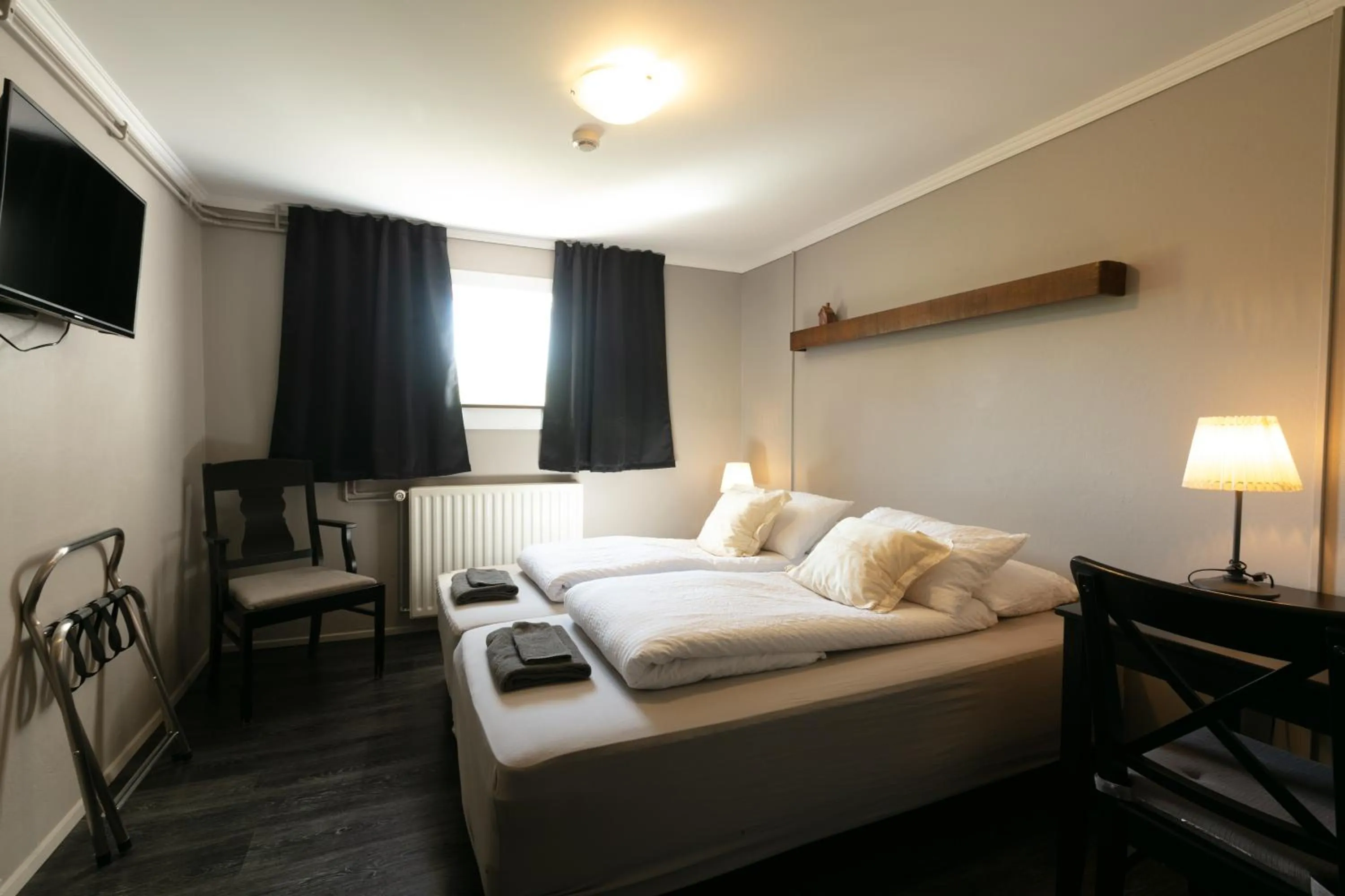 Bed in Karuna Guesthouse