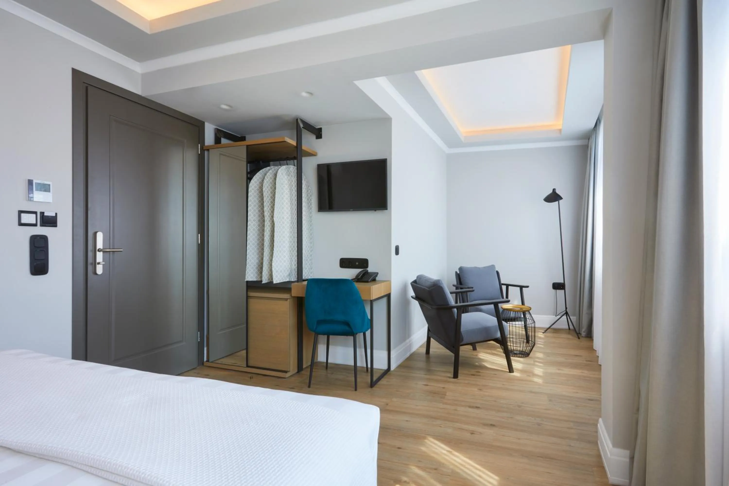 Seating area, Bed in The Artist Athens