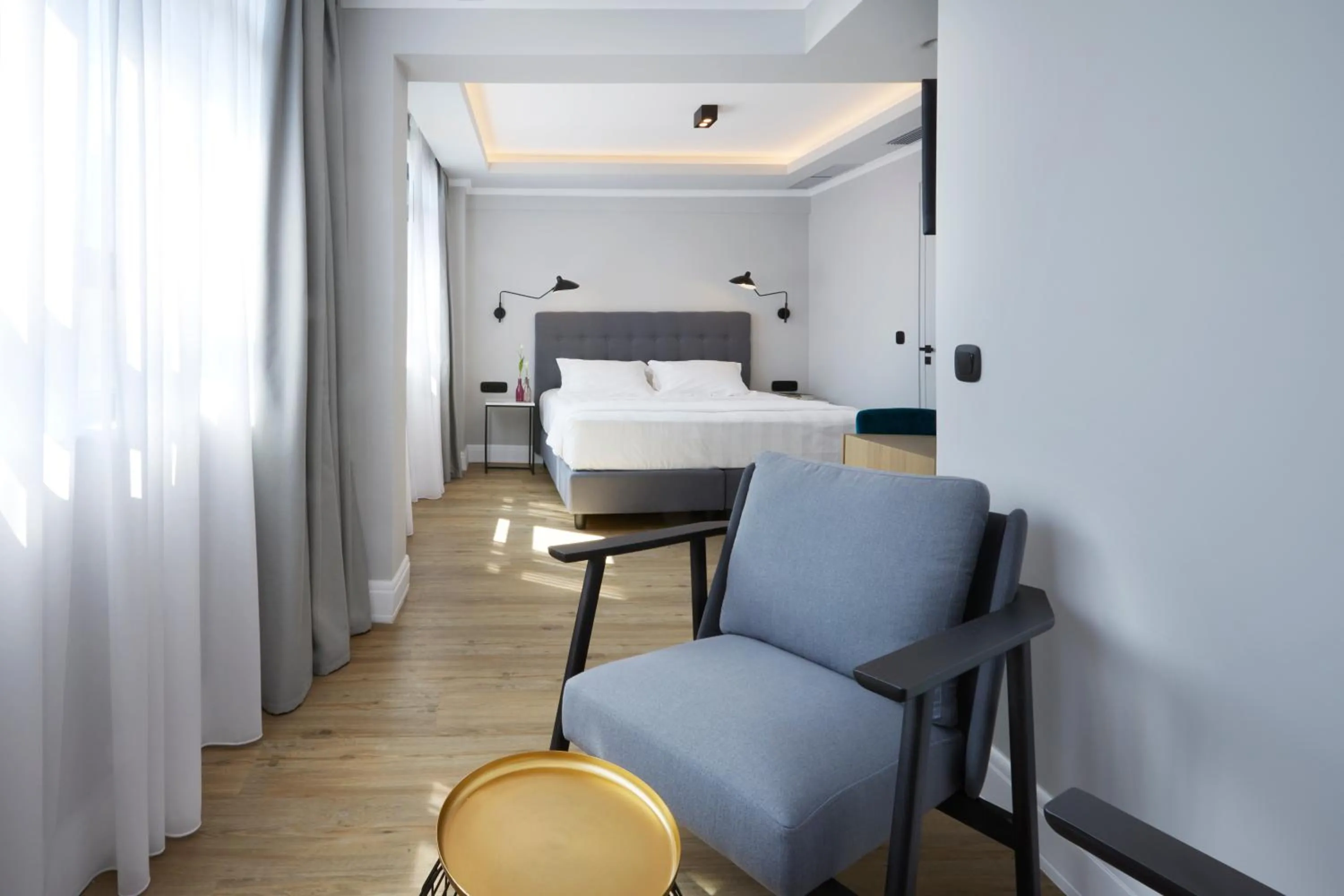 Seating area, Bed in The Artist Athens