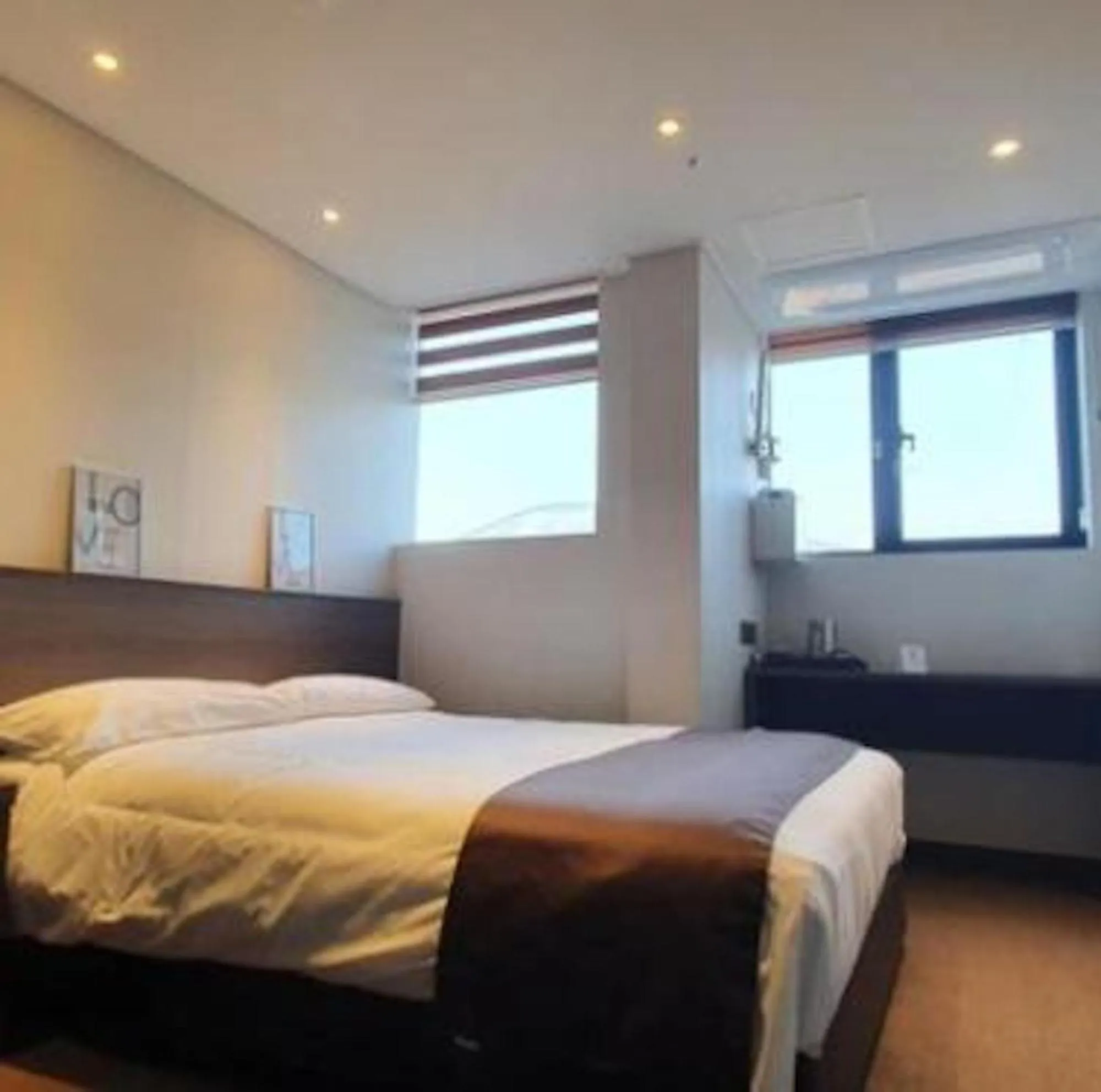 Bed in Grandmillions Hotel Seogwipo