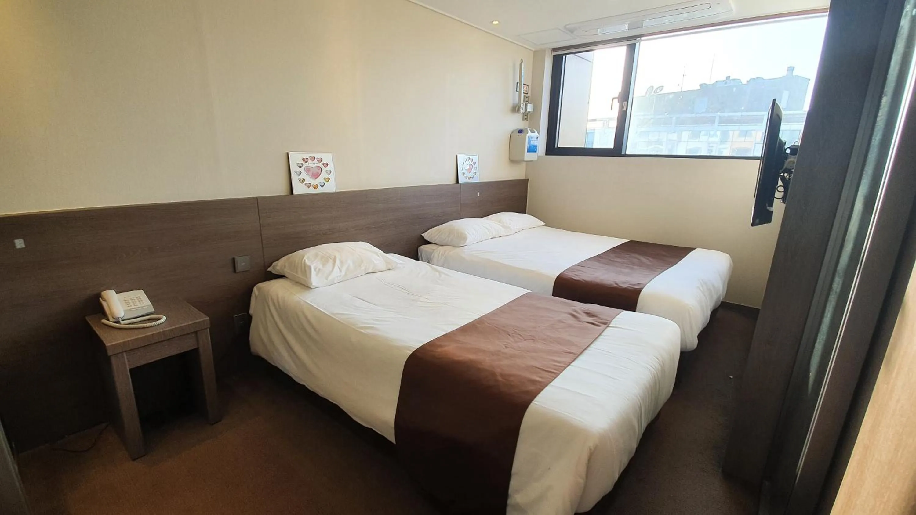 Bed in Grandmillions Hotel Seogwipo