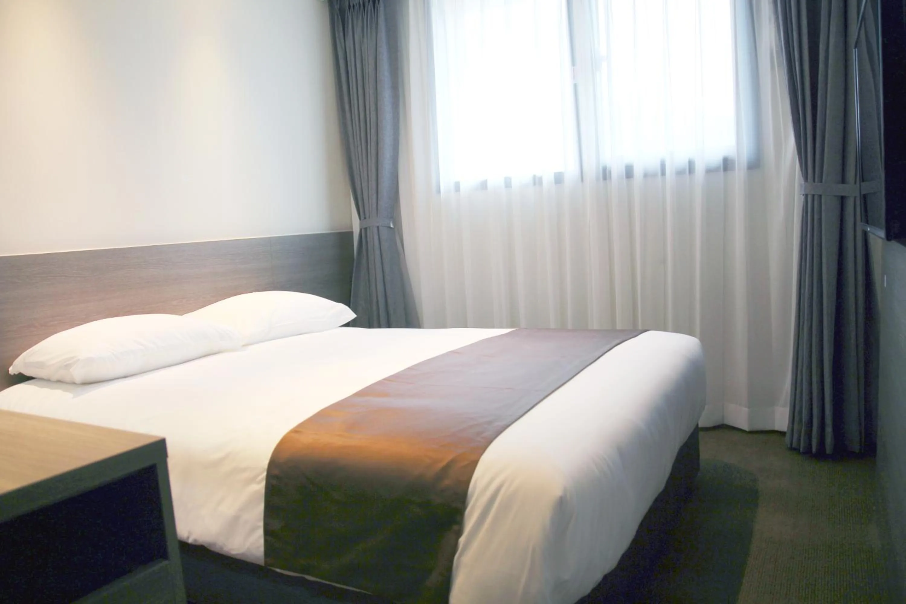 Photo of the whole room, Bed in Grandmillions Hotel Seogwipo