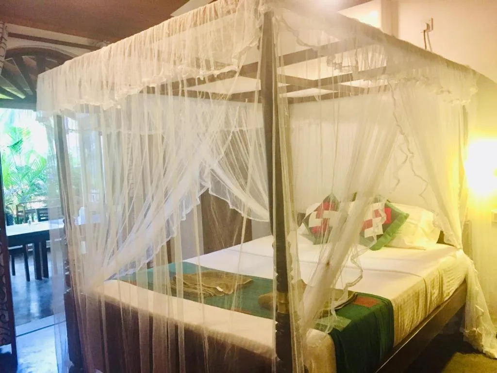 Bed in Goyambokka Guesthouse