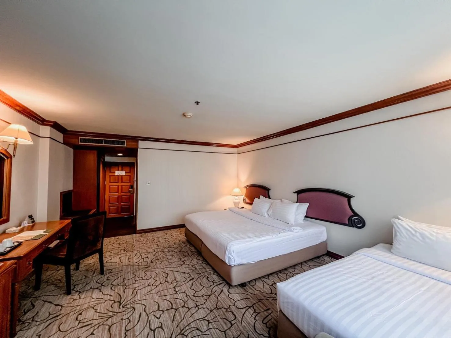 Bed in The Twin Lotus Hotel