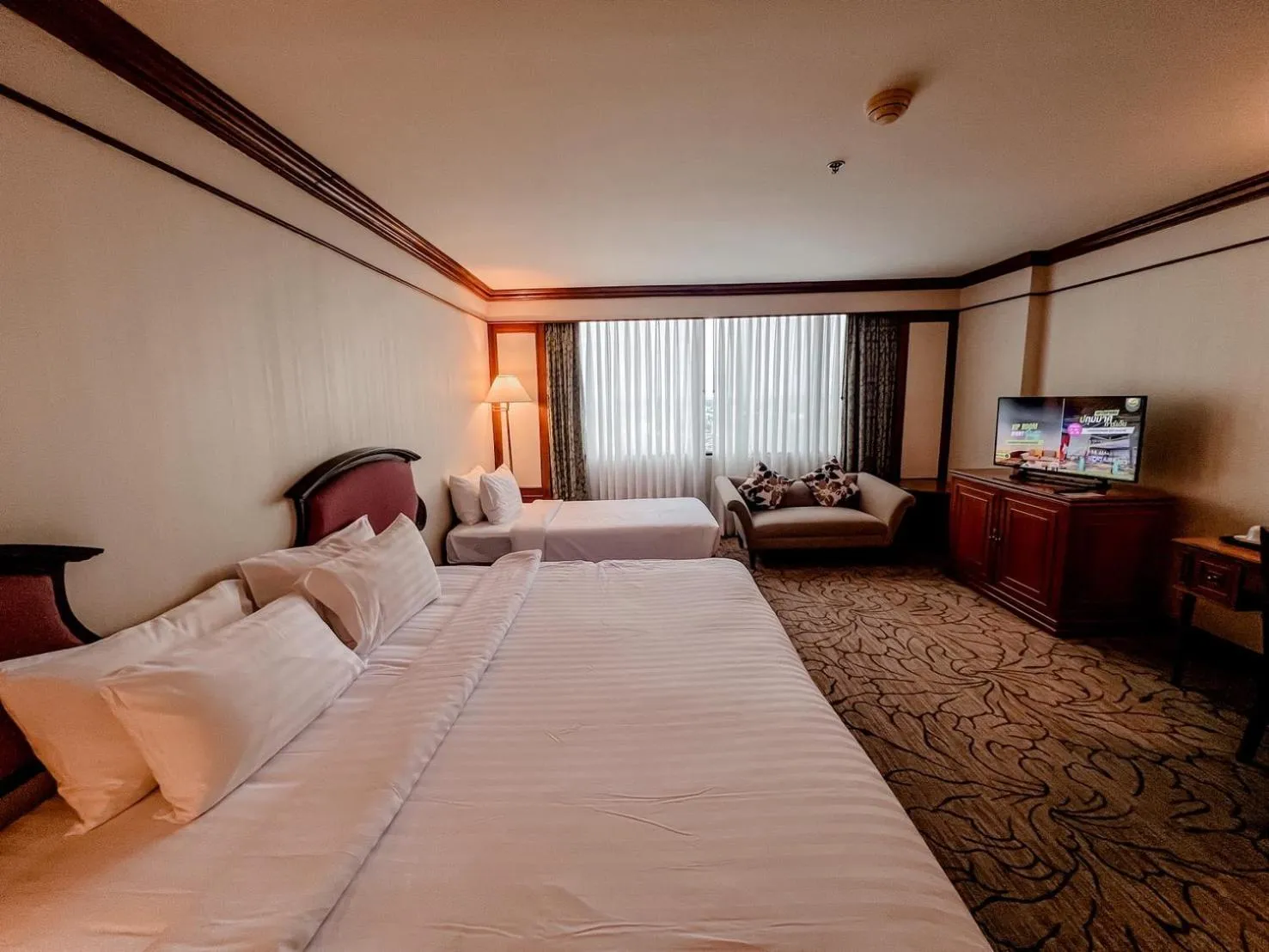 Bed in The Twin Lotus Hotel