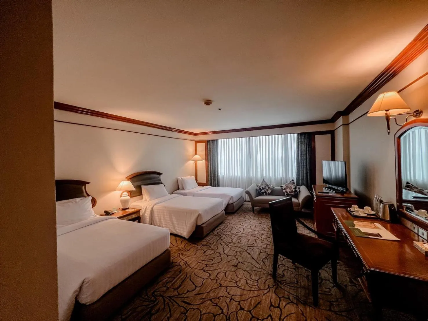 Bed in The Twin Lotus Hotel