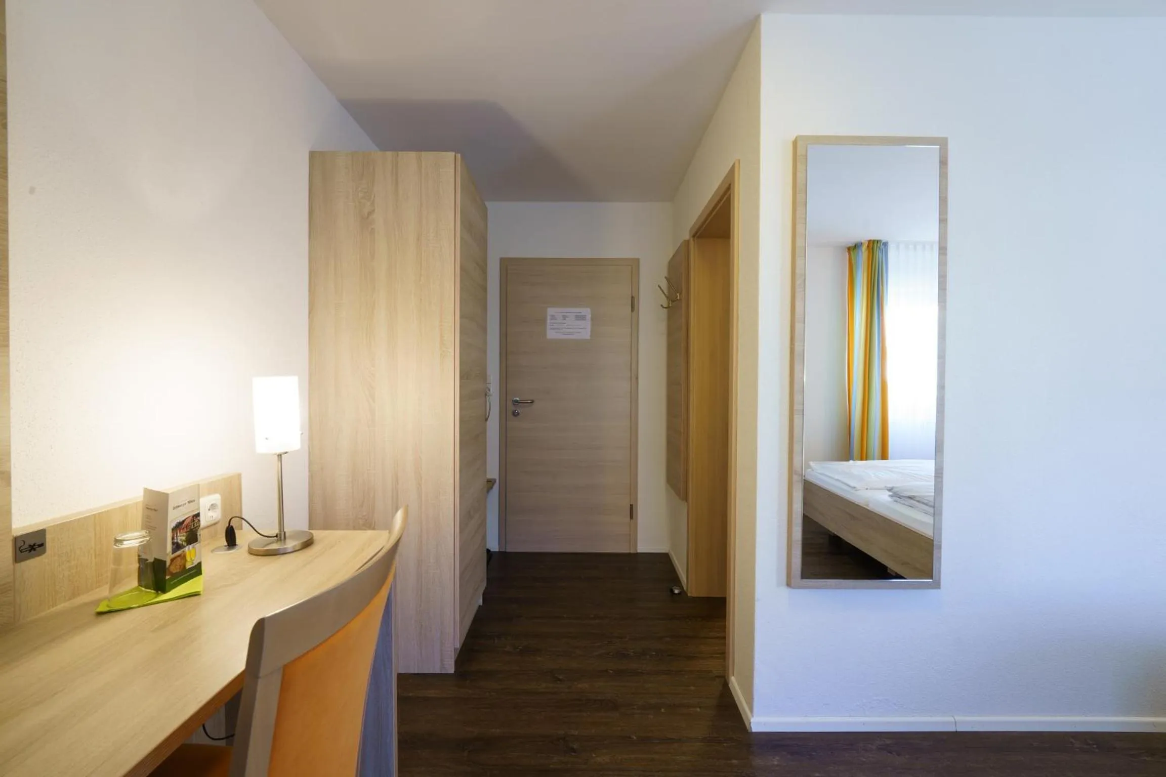 Photo of the whole room, Bed in Gasthaus Schwarzer Adler