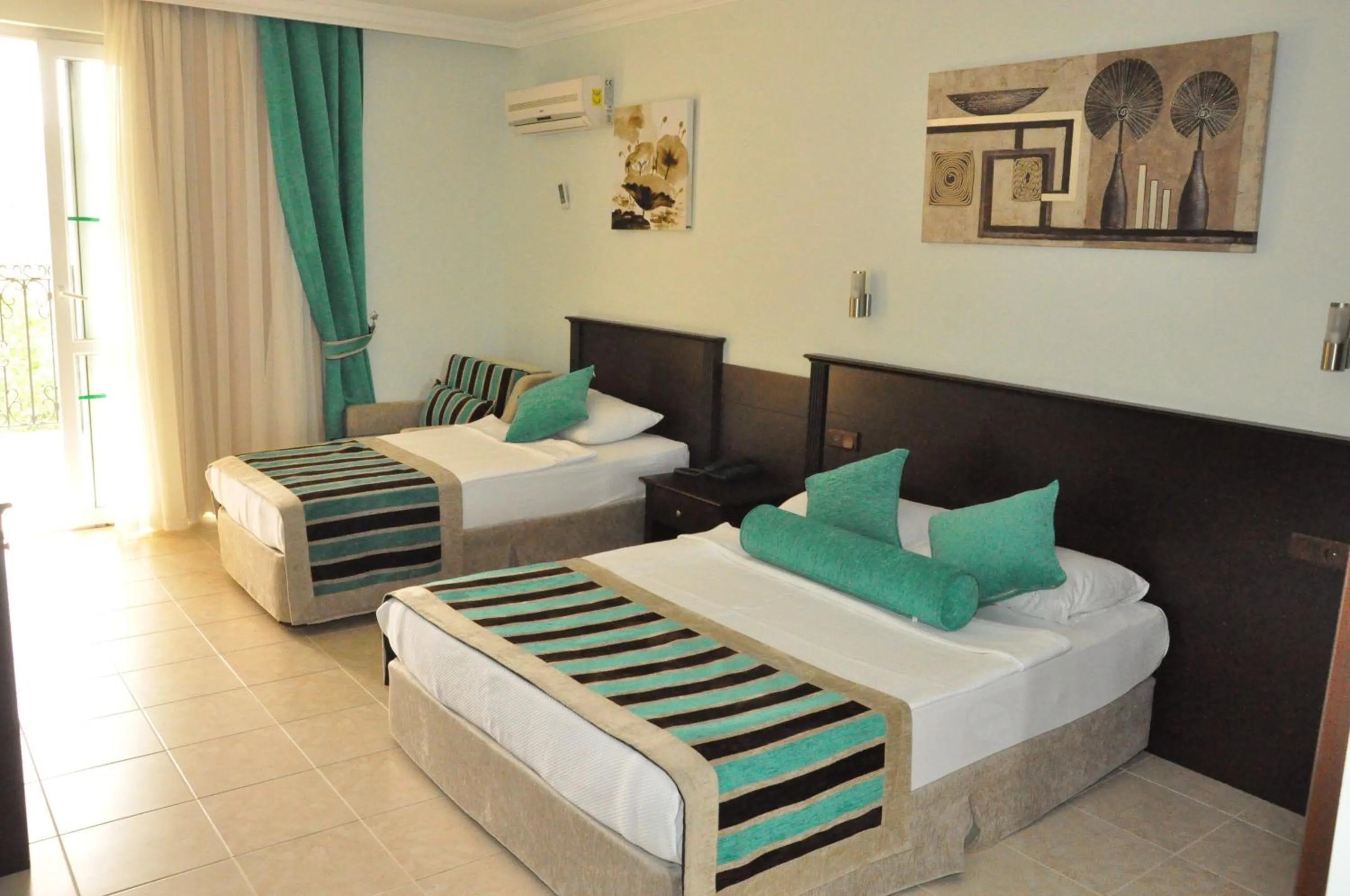 Bed in Kleopatra Royal Palm Hotel