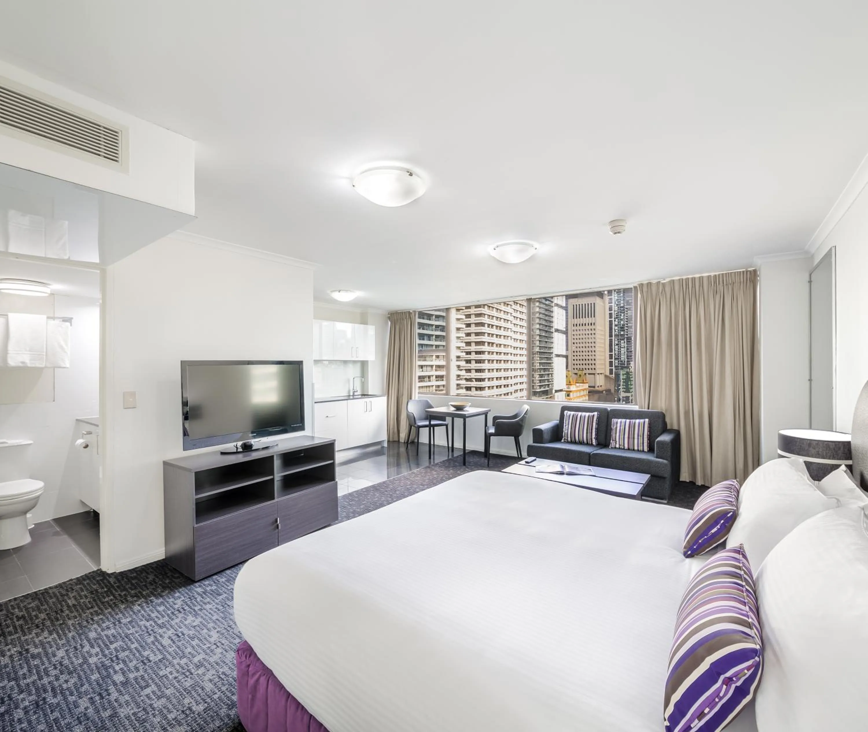 Bed in Oaks Sydney Hyde Park Suites