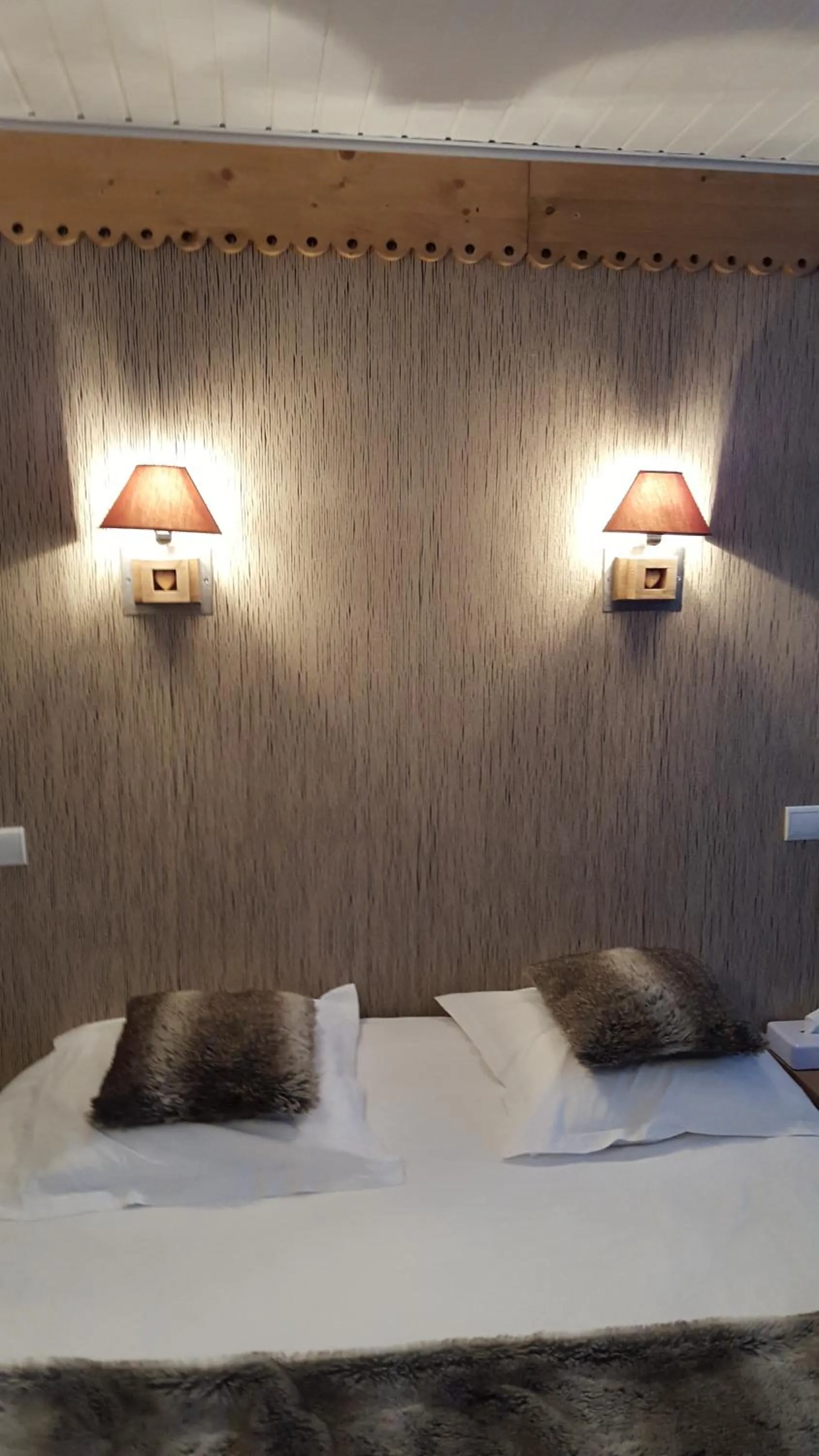 Bed in Logis Hotel Les Sapins