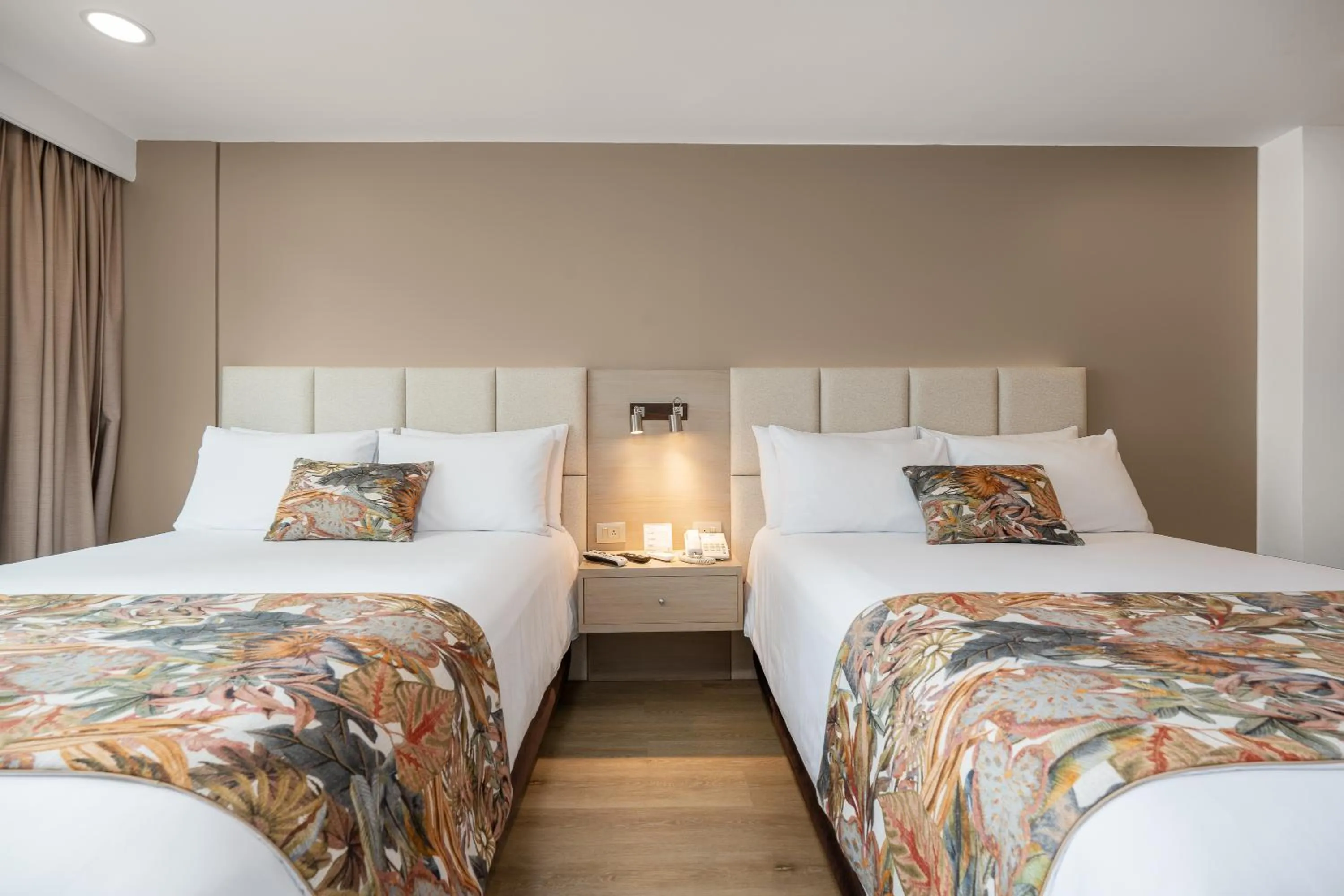 Bed in Novelty Suites Hotel - Oviedo Mall