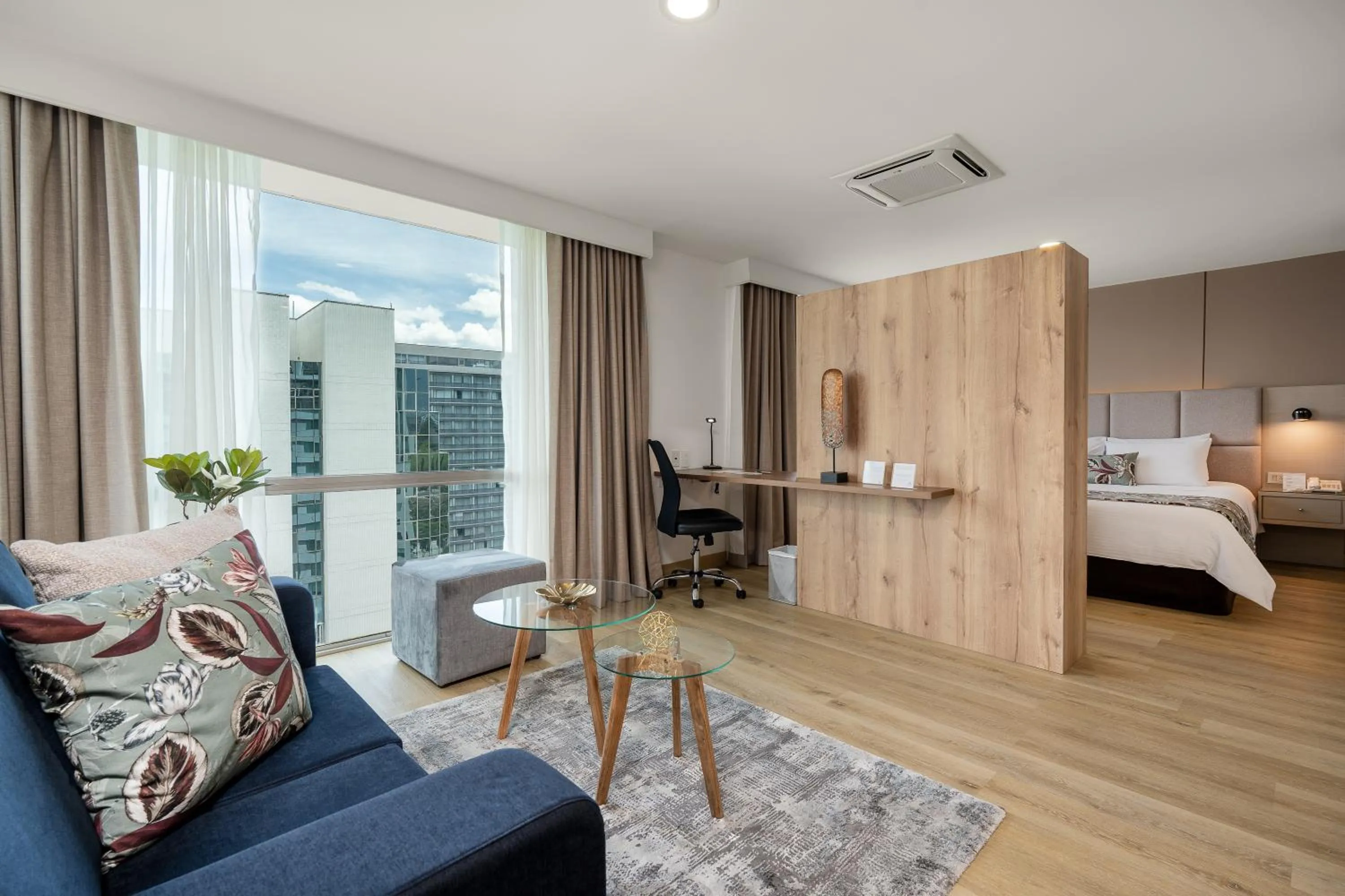 Bed in Novelty Suites Hotel - Oviedo Mall