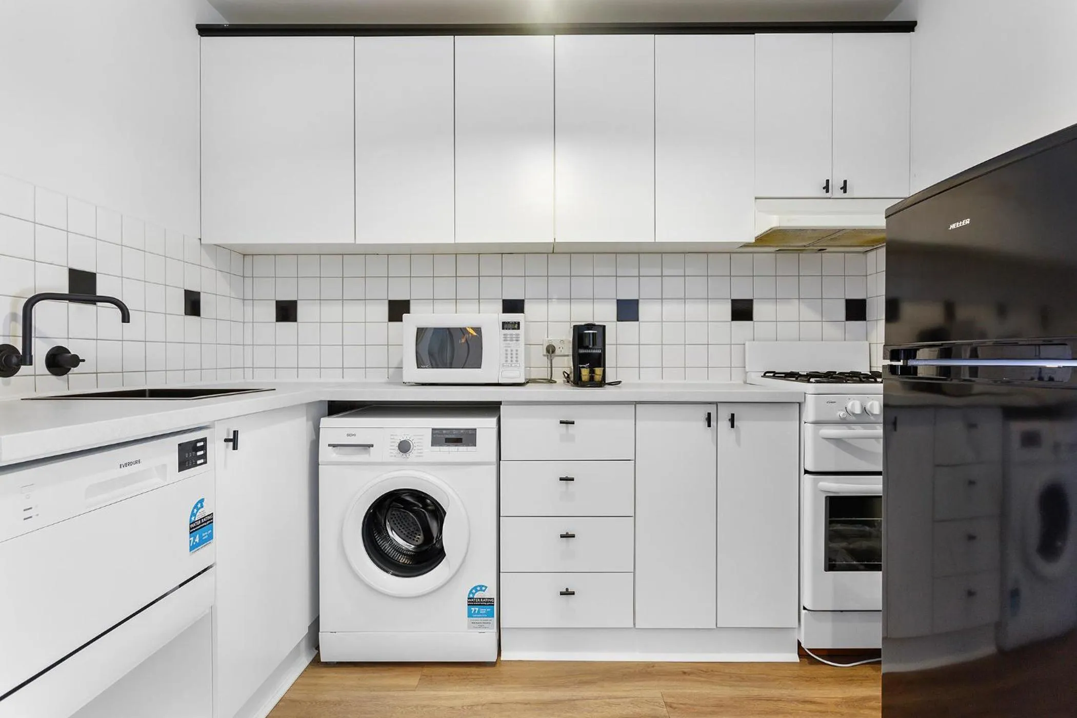 washing machine in SoYa on Davis Apartment Hotel