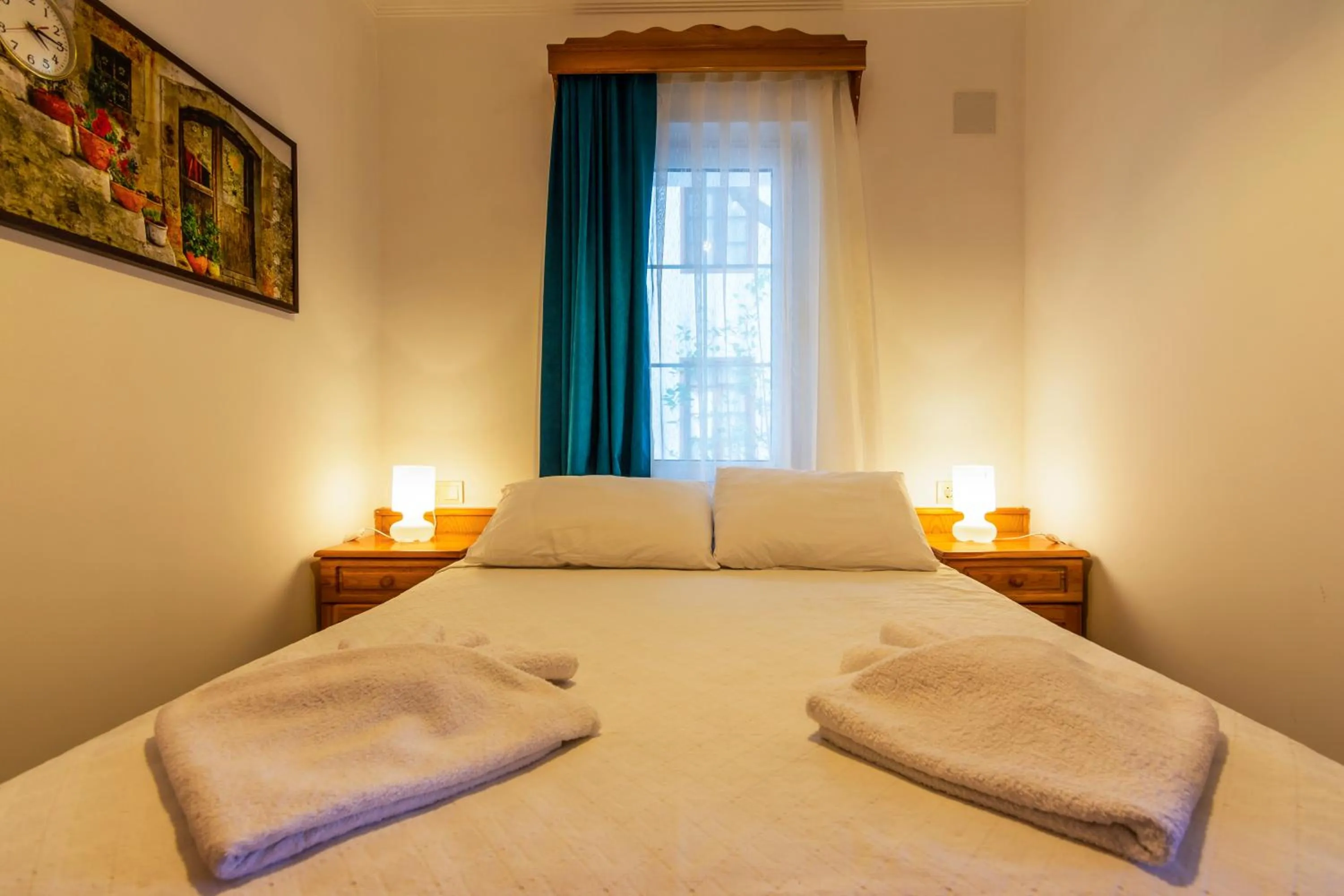 Bed in Calypso Cozy Suites