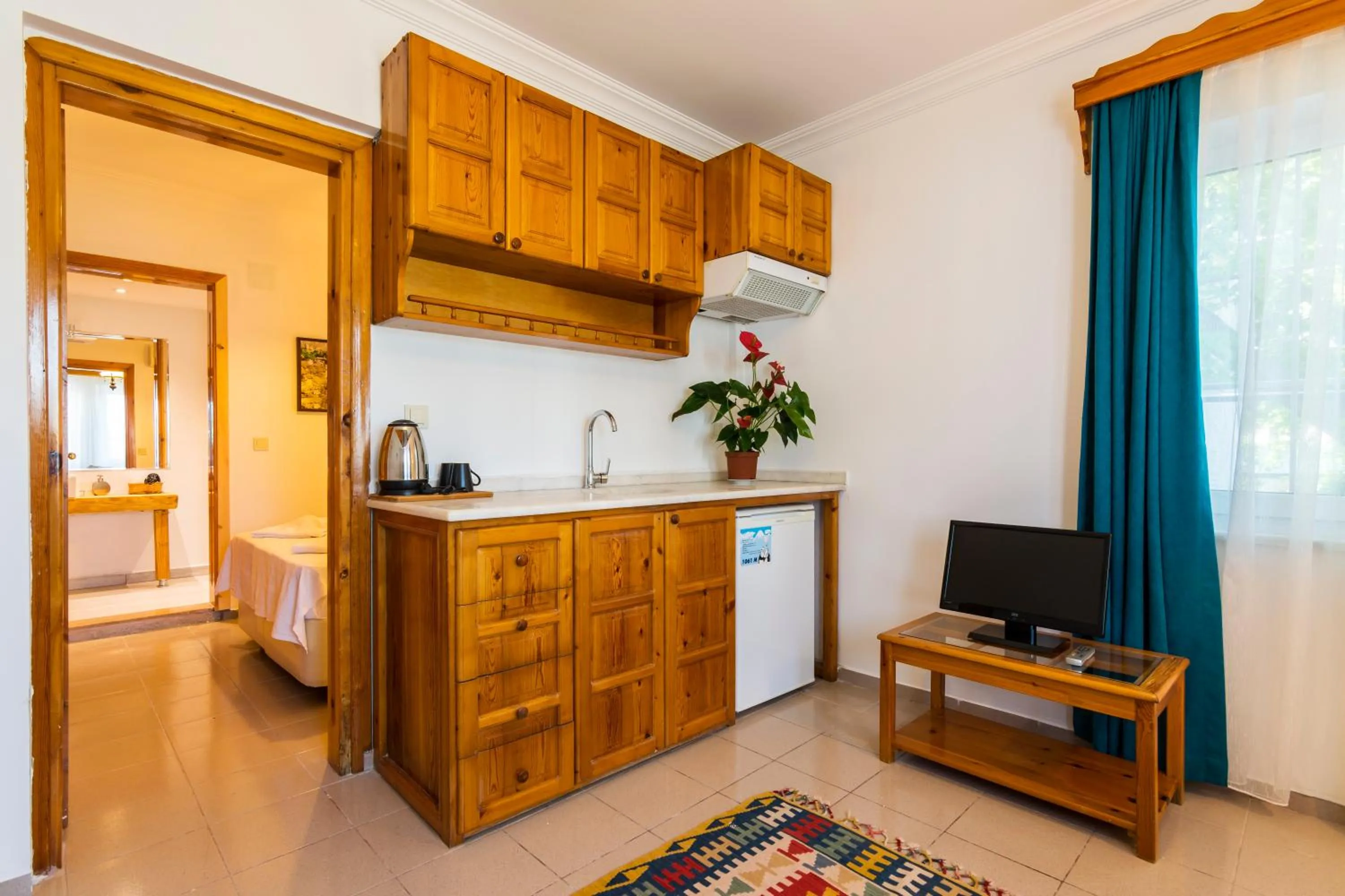 Kitchen or kitchenette, Bed in Calypso Cozy Suites