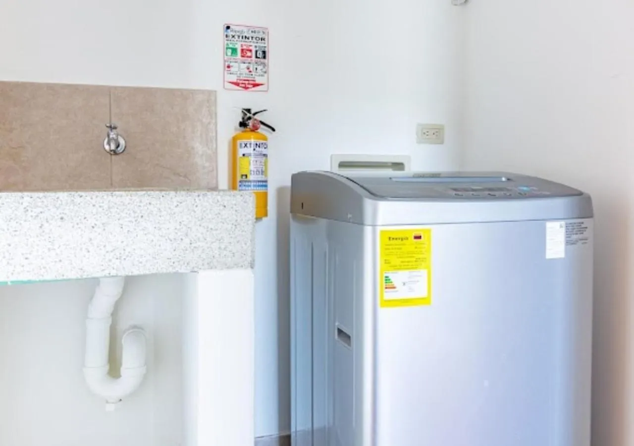 washing machine in Affinity ApartaHotel - Extended Stay