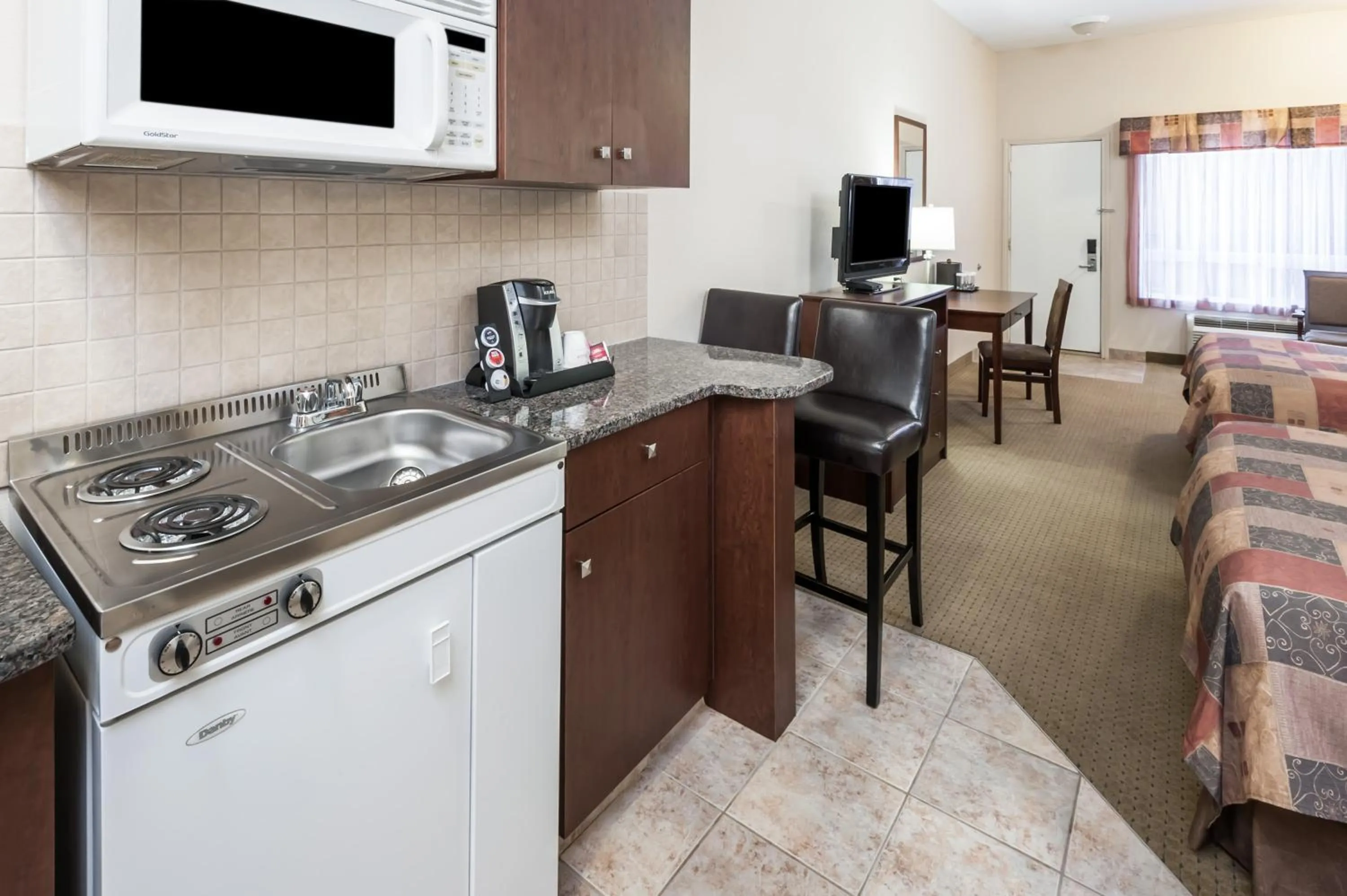 Kitchen or kitchenette in Ramada by Wyndham High River