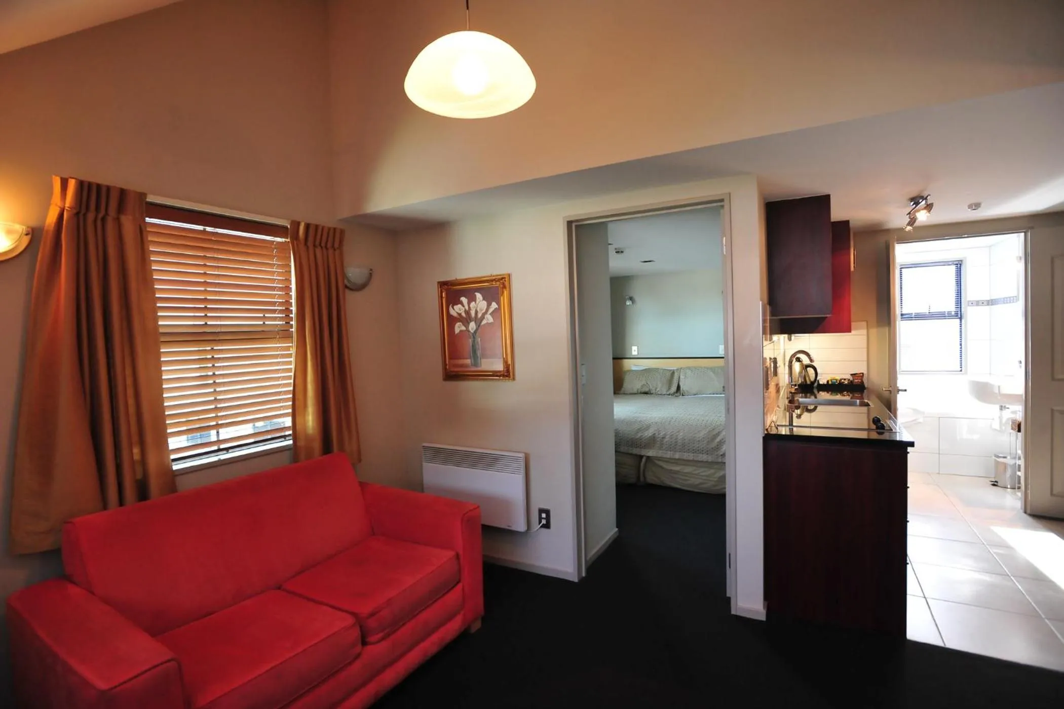 Seating area, Bed in Athena Motel