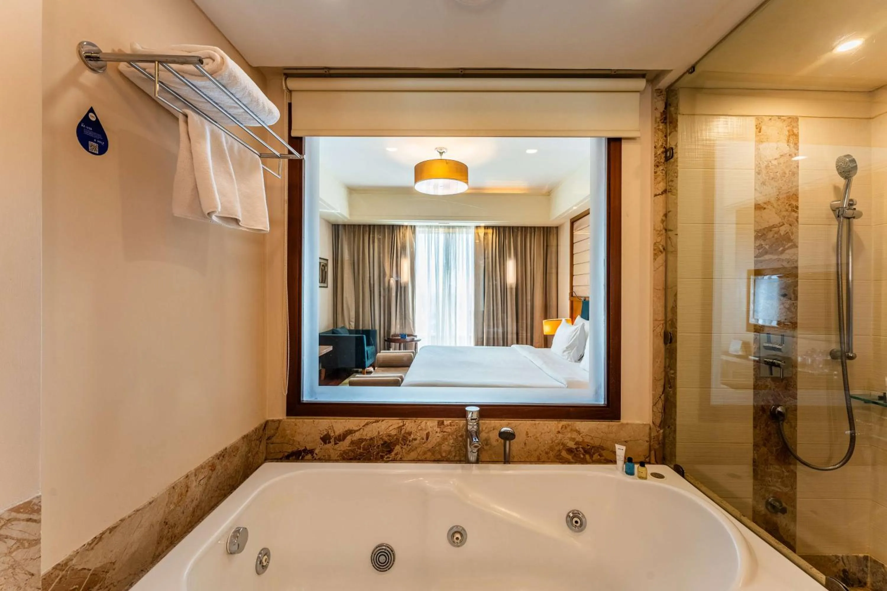 Bathroom, Bed in Radisson Blu Hotel, Indore